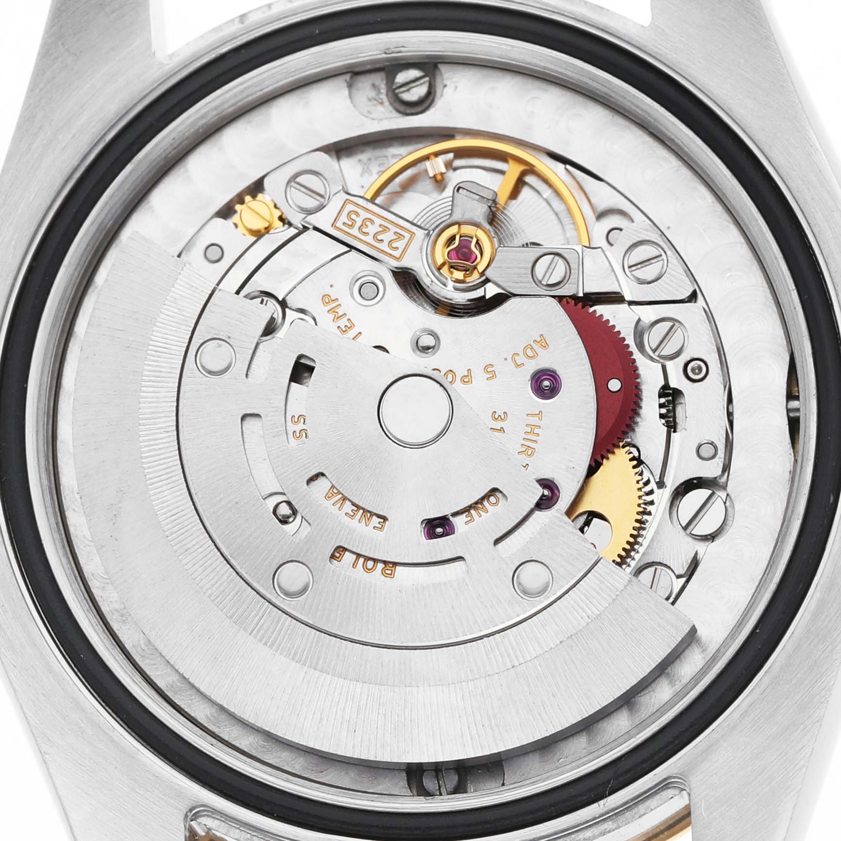 The image shows the back view of a Rolex Mid-Size 178273 Women's Steel and Gold (two tone) Champagne Dial watch, highlighting its intricate movement and rotor.