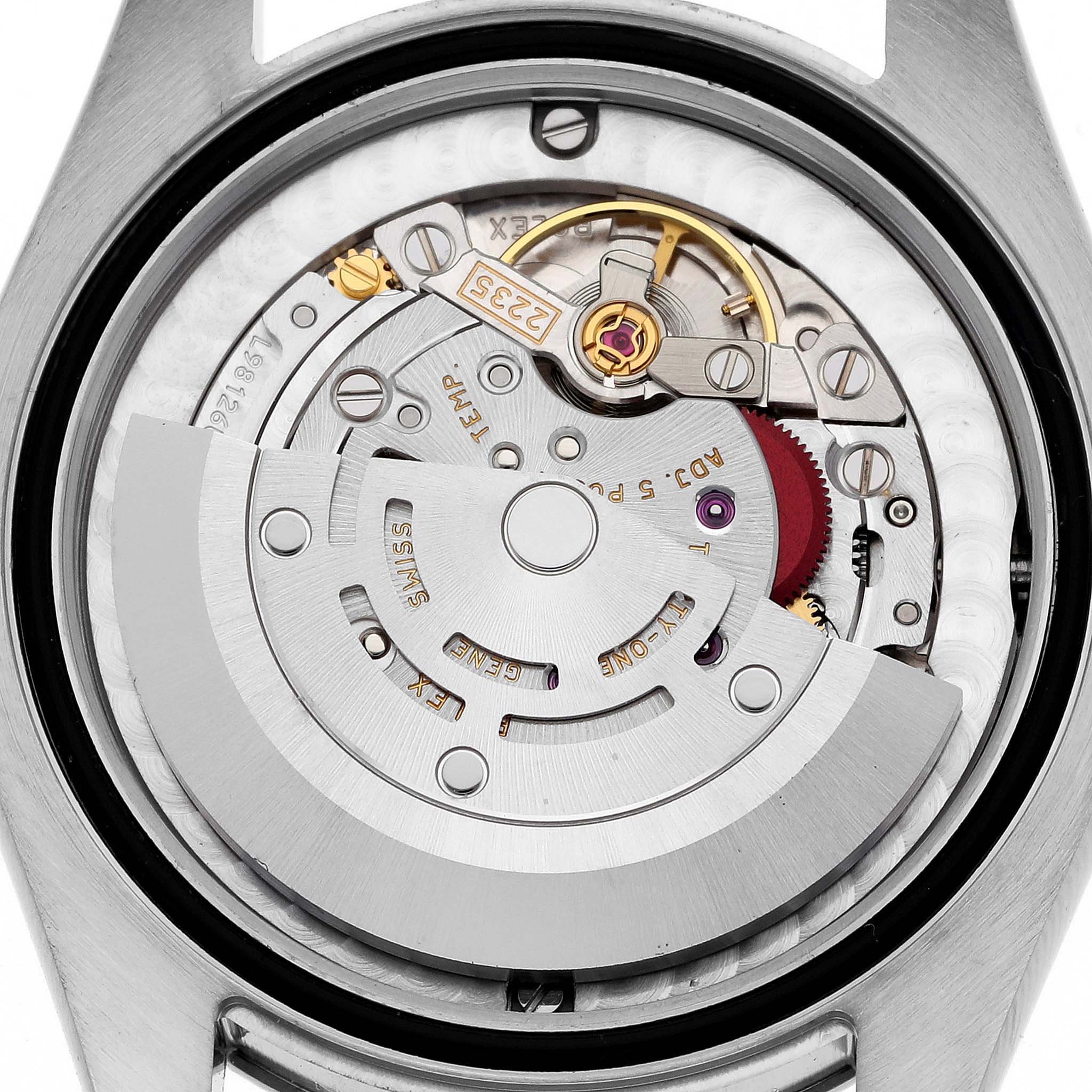 The image shows the inner mechanical movement of a Mid-Size Rolex watch viewed from the back.