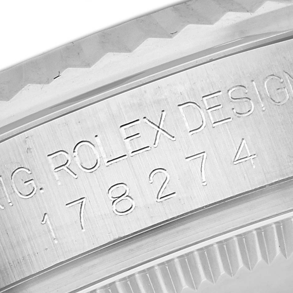 This close-up angle shows the engraved side of the bezel and part of the case of the Mid-Size Rolex watch, including the model number.