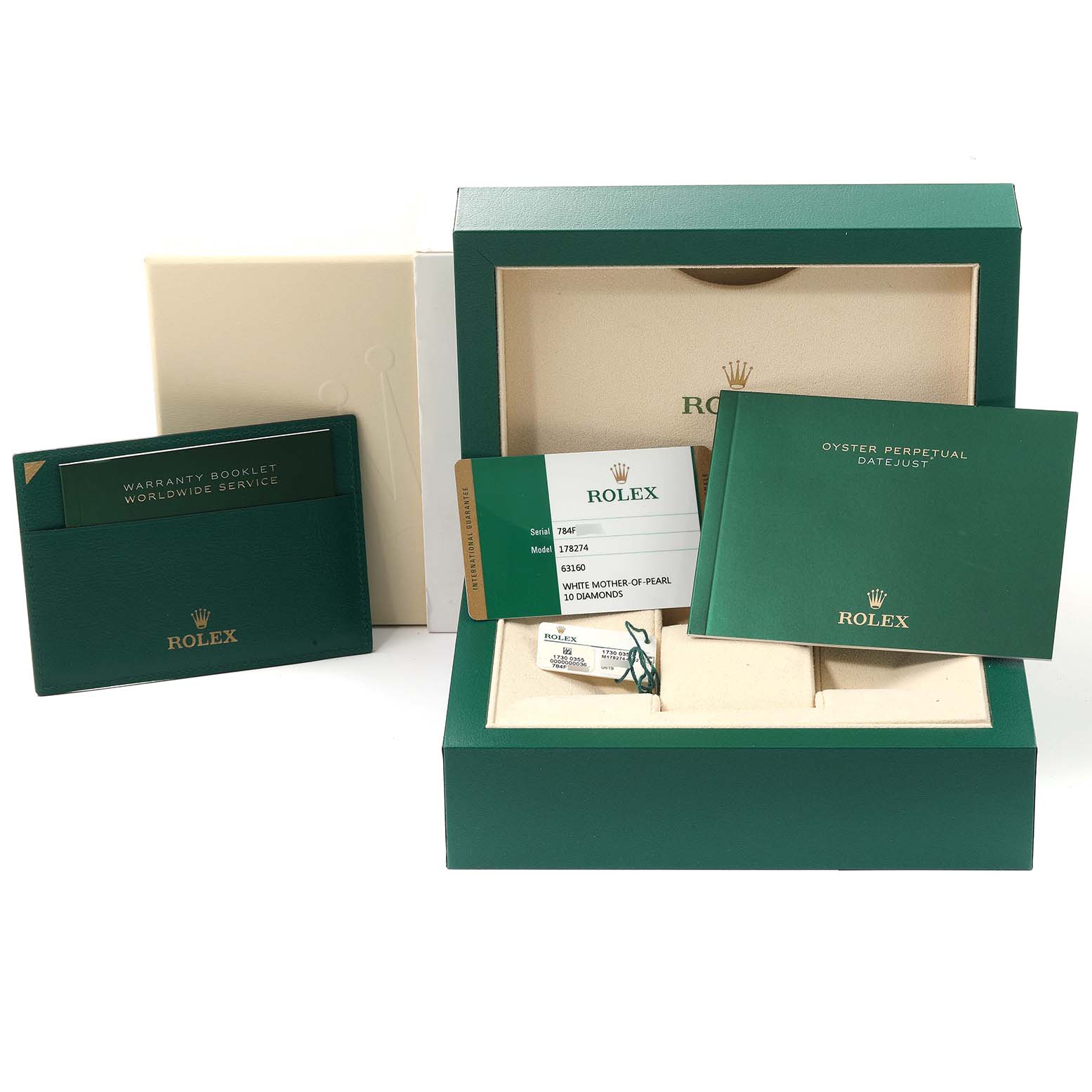 The image shows the packaging, warranty booklet, certificate, and tags of a Rolex Mid-Size 178274 Women
s Stainless Steel Mother of Pearl Dial 178274 Women
s Stainless Steel Mother of Pearl Dial model watch.