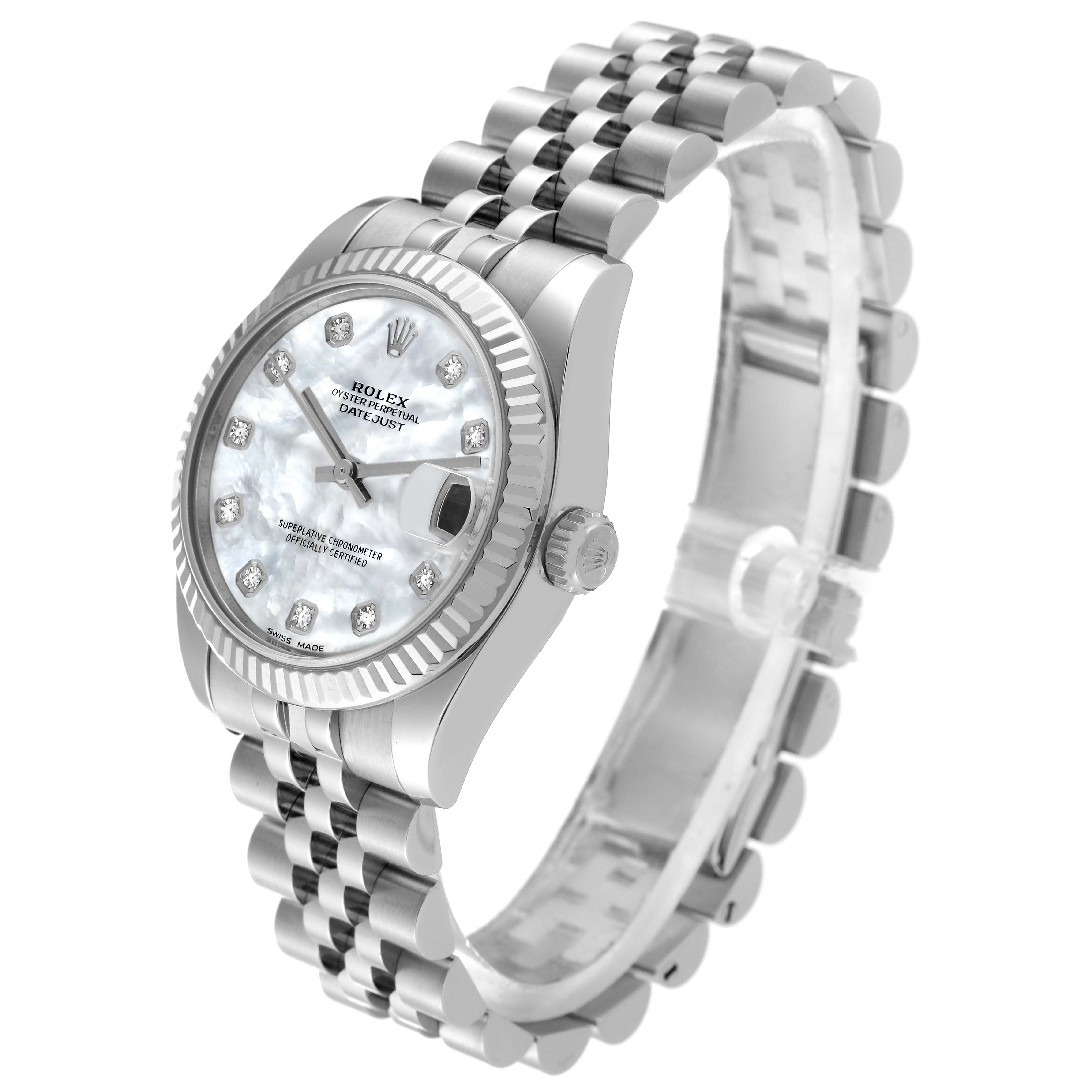 The image shows a Rolex Mid-Size 178274 Women
s Stainless Steel Mother of Pearl Dial 178274 Women
s Stainless Steel Mother of Pearl Dial Datejust watch from an angled side view, highlighting the face, bezel, and bracelet.