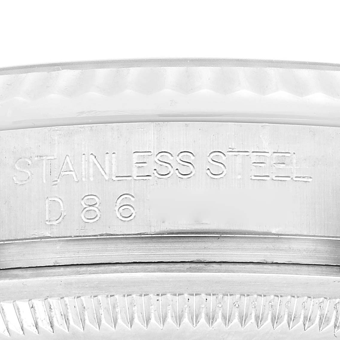 This is a close-up of the side engraving on the stainless steel case of a Rolex Datejust 116234 Men's Stainless Steel Silver Dial 116234 Men's Stainless Steel Silver Dial watch.