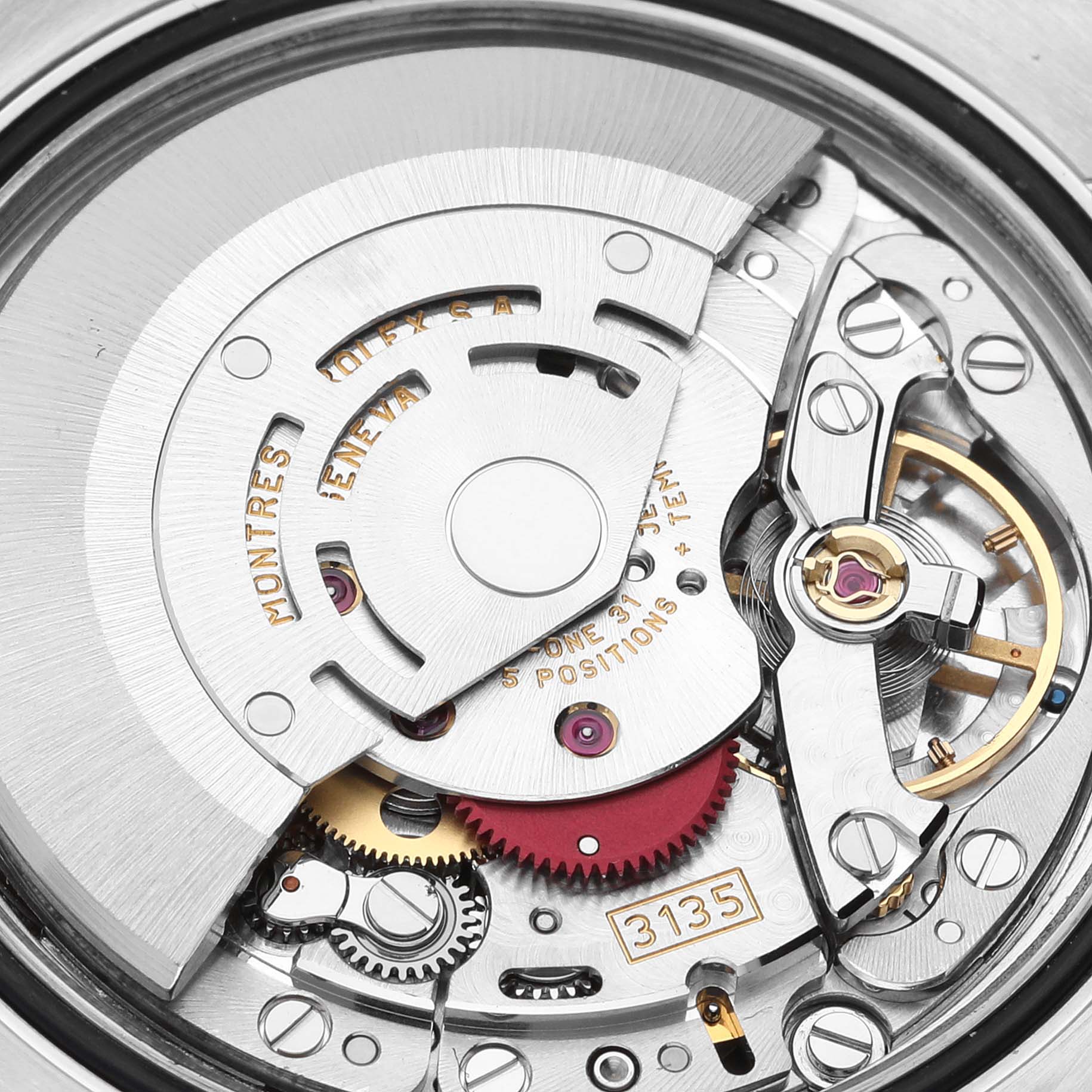 This image shows a close-up of the movement mechanism of a Rolex Datejust 116234 Men's Stainless Steel Silver Dial 116234 Men's Stainless Steel Silver Dial watch, focusing on the intricate mechanical parts.