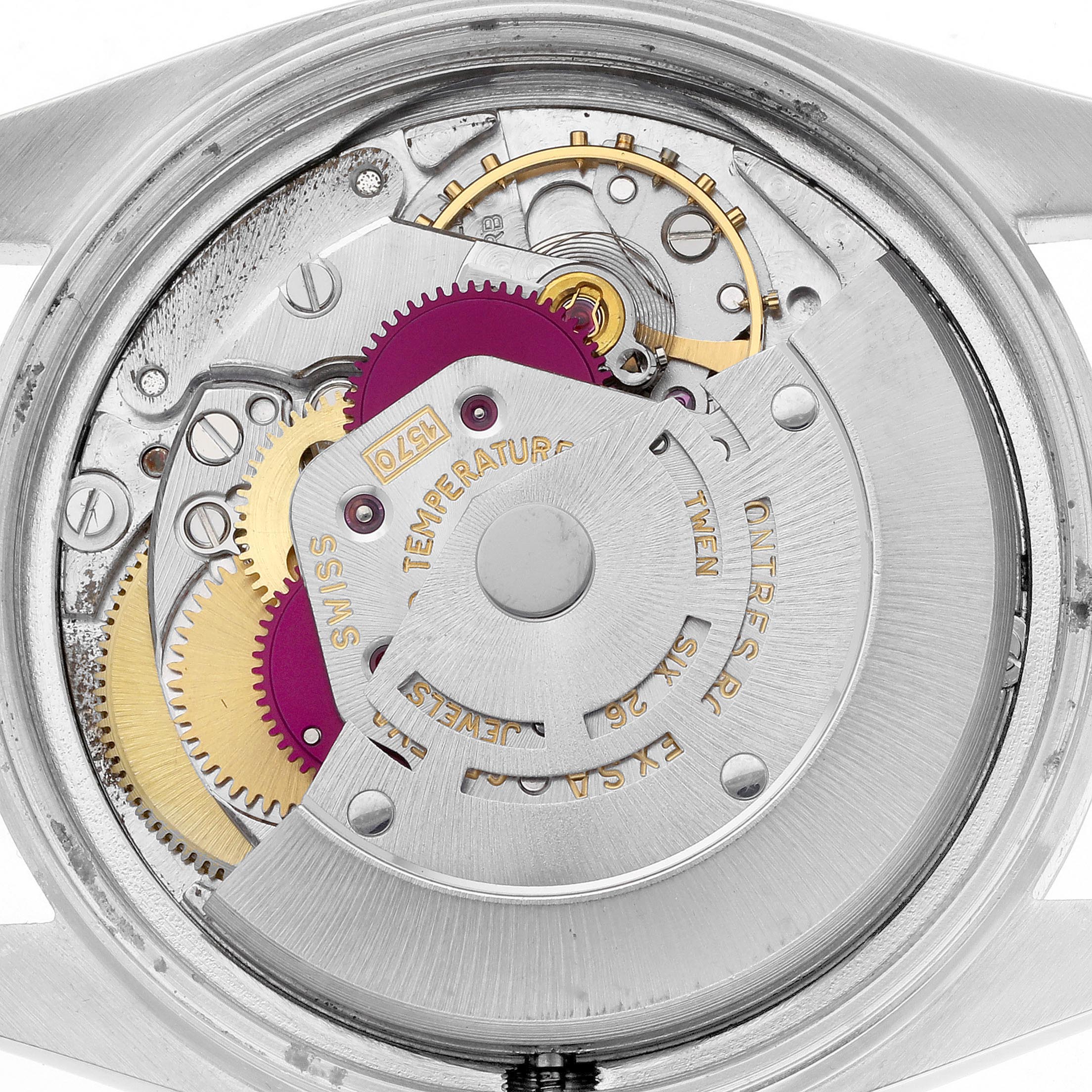 This image shows the movement of a Rolex Datejust 1601 Men's Stainless Steel White Dial 1601 Men's Stainless Steel White Dial watch from a top-down angle, highlighting gears and the automatic rotor.