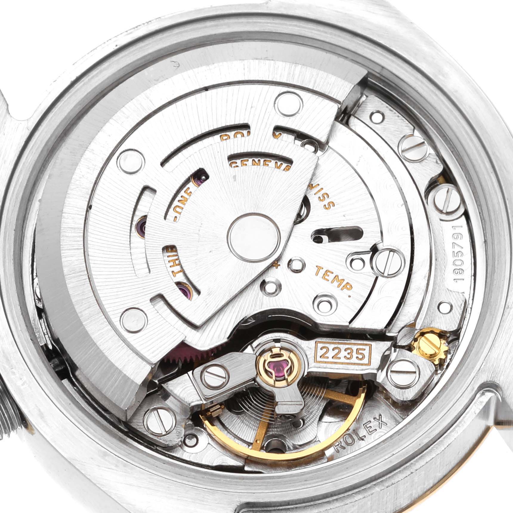 This image shows the internal mechanisms of a Rolex Datejust 179173 Women's Steel and Gold (two tone) Mother of Pearl Dial 179173 Women's Steel and Gold (two tone) Mother of Pearl Dial watch, focusing on the movement and rotor components.