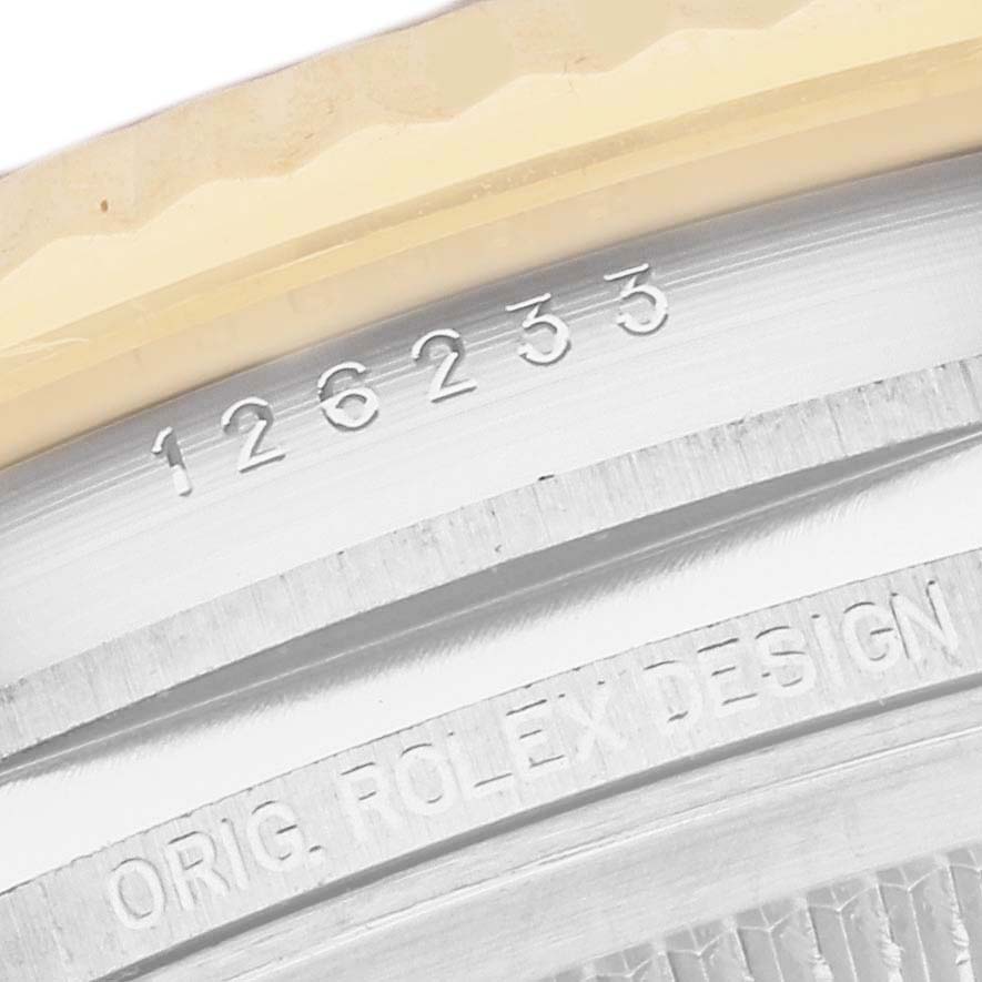 This image shows a close-up of the case side and bezel of a Rolex Datejust 126233 Men's Steel and Gold (two tone) White Dial 126233 Men's Steel and Gold (two tone) White Dial model, revealing the watch's reference number, "126233," and "ORIG. ROLEX DESIGN" engraved.