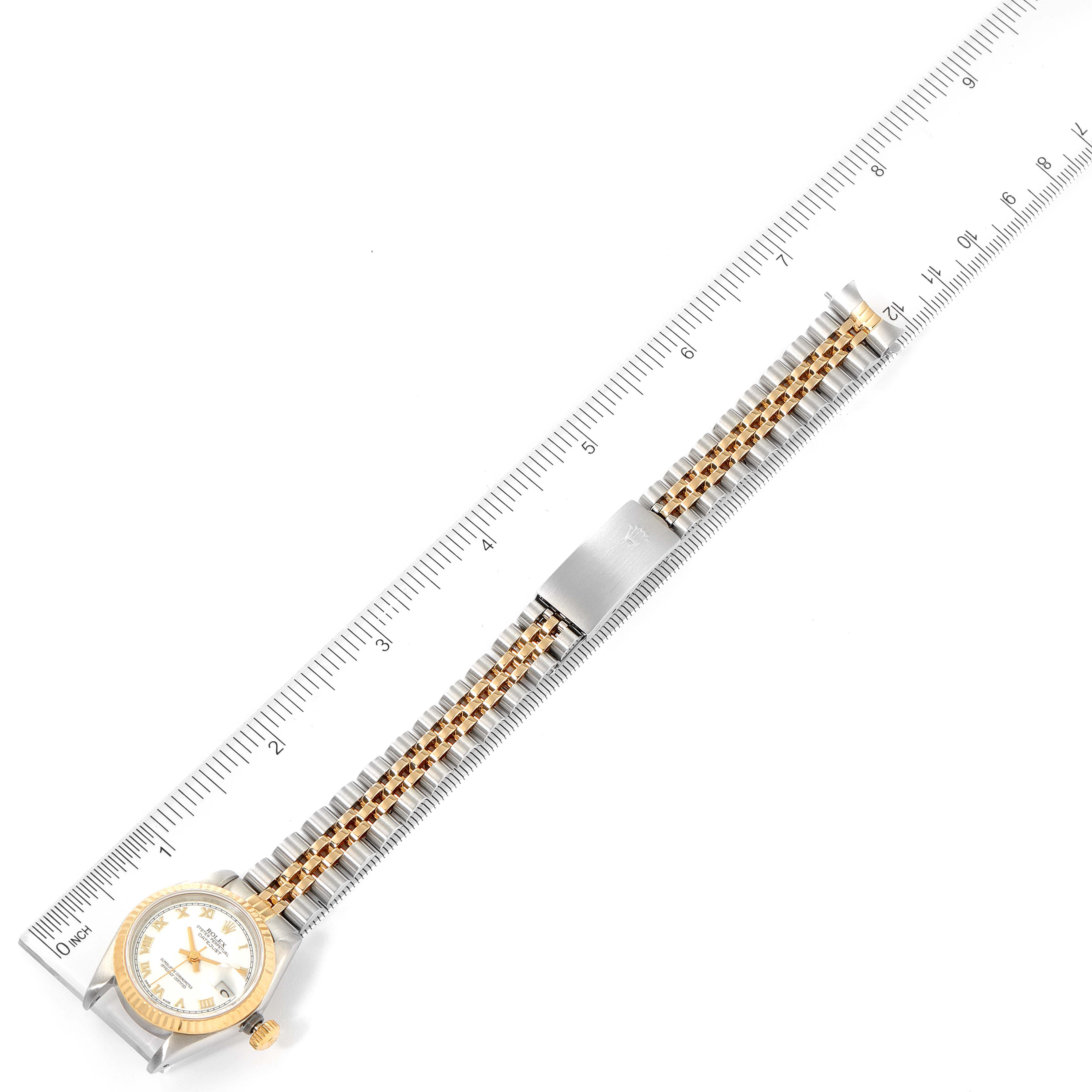 This top-down image showcases the full length, bracelet, and face of a Rolex Datejust 69173 Women's Steel and Gold (two tone) White Dial 69173 Women's Steel and Gold (two tone) White Dial watch alongside a ruler for scale.