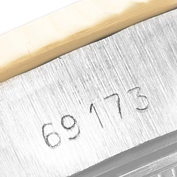 This close-up image shows the model number engraved on the case side of a Rolex Datejust 69173 Women's Steel and Gold (two tone) White Dial 69173 Women's Steel and Gold (two tone) White Dial.
