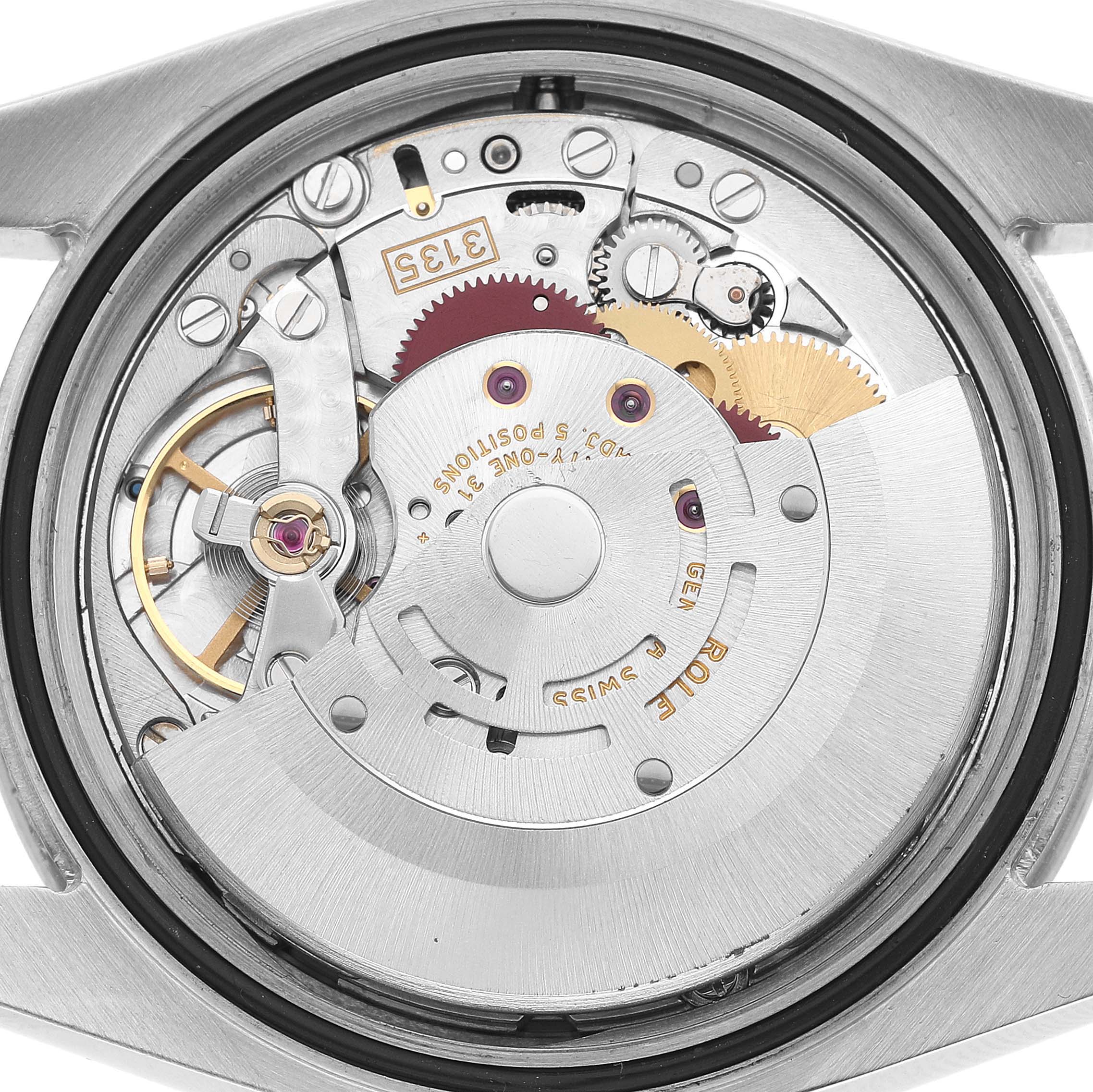 The image shows the movement of a Rolex Turn-o-Graph 116264 Men's Stainless Steel Blue Dial watch from a top-down angle, highlighting gears and components.