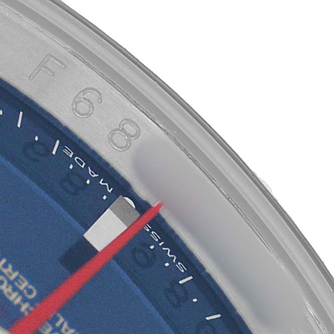 The image shows a close-up of the bezel and part of the dial of a Rolex Turn-o-Graph 116264 Men's Stainless Steel Blue Dial watch.