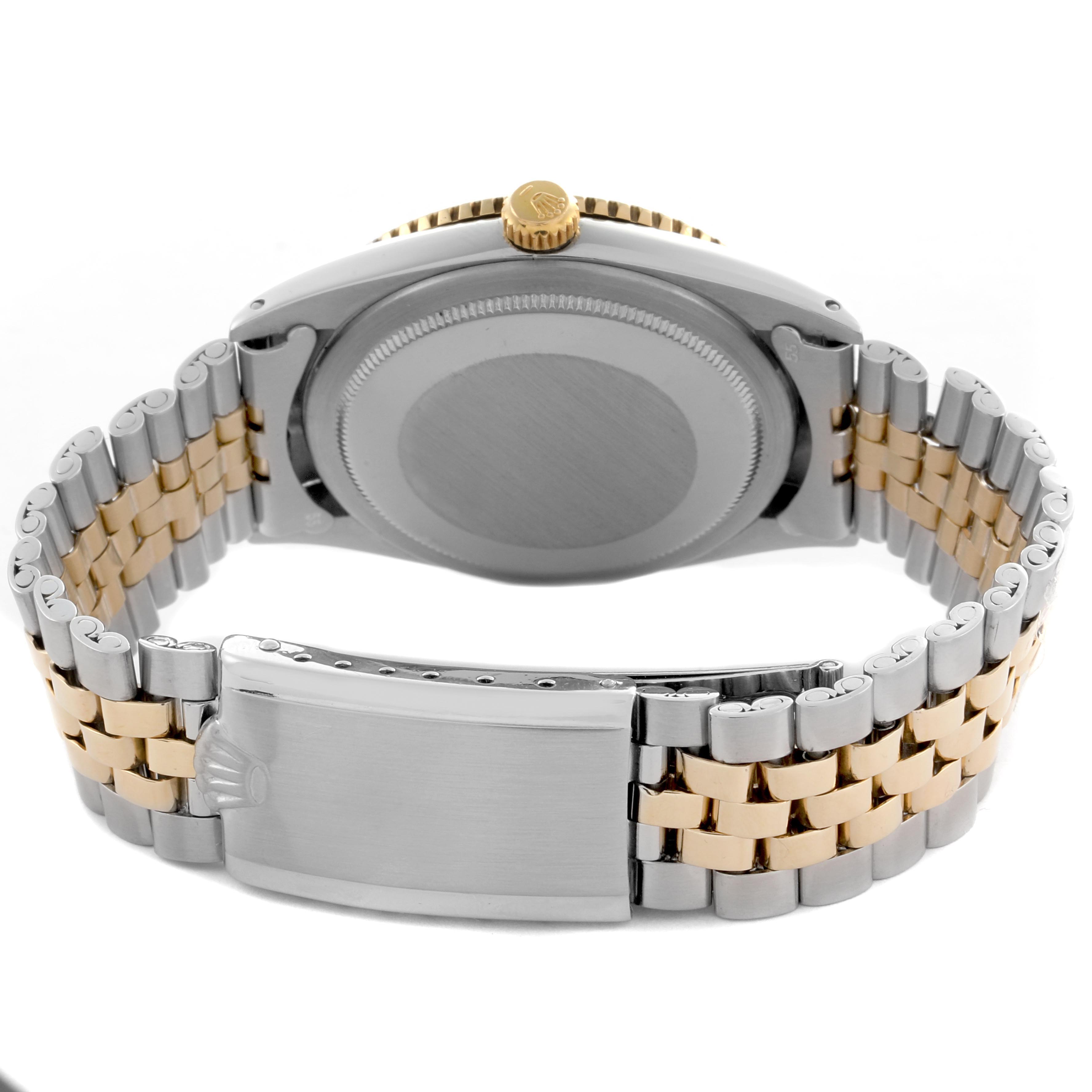 The Rolex Turn-o-Graph 1625 Men's Steel and Gold (two tone) Silver Dial 1625 Men's Steel and Gold (two tone) Silver Dial watch is shown from the back, displaying its case back, crown, and jubilee bracelet.