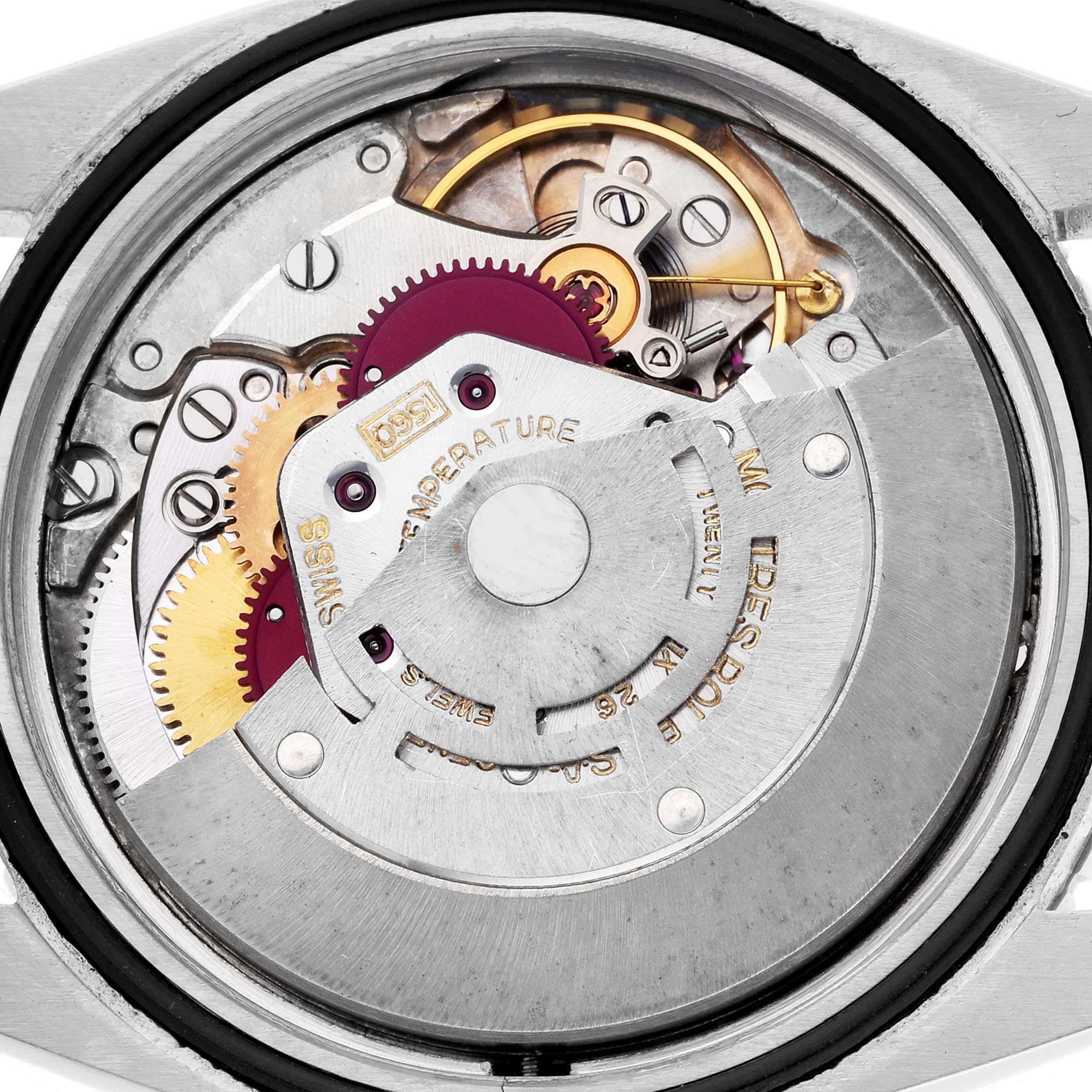 The image shows a close-up of the Rolex Turn-o-Graph 1625 Men's Steel and Gold (two tone) Silver Dial 1625 Men's Steel and Gold (two tone) Silver Dial watch movement, revealing gears and the intricate inner mechanism.