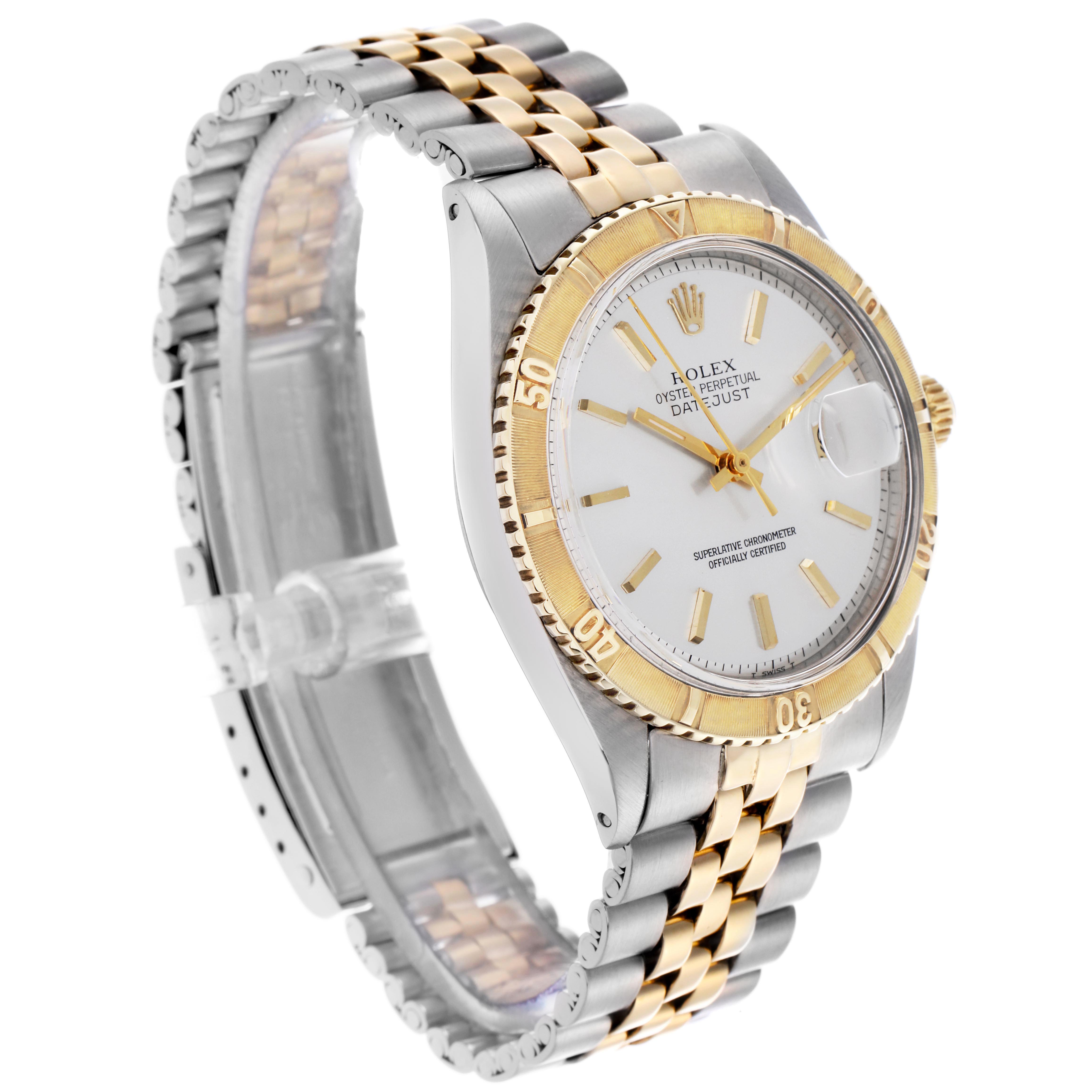 The Rolex Turn-o-Graph 1625 Men's Steel and Gold (two tone) Silver Dial 1625 Men's Steel and Gold (two tone) Silver Dial watch is shown at a three-quarter angle, displaying the face, bezel, bracelet, and side profile.