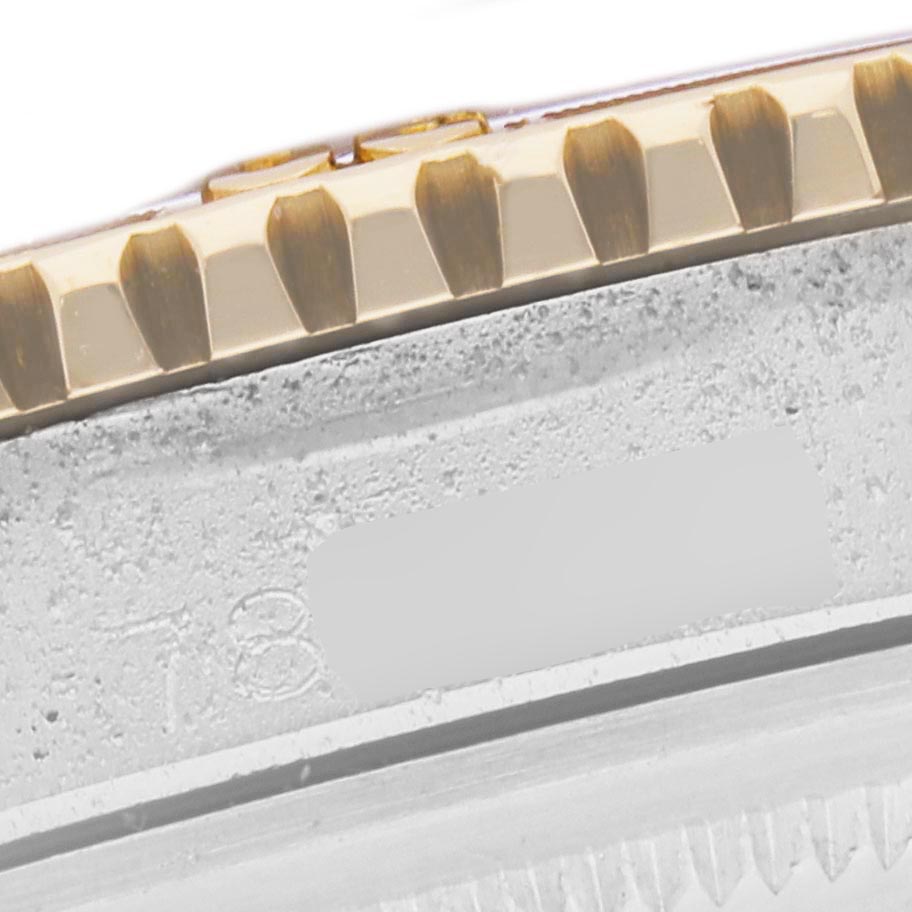 The image shows a close-up of the gold bezel edge and part of the case of a Rolex Turn-o-Graph 1625 Men's Steel and Gold (two tone) Silver Dial 1625 Men's Steel and Gold (two tone) Silver Dial model.