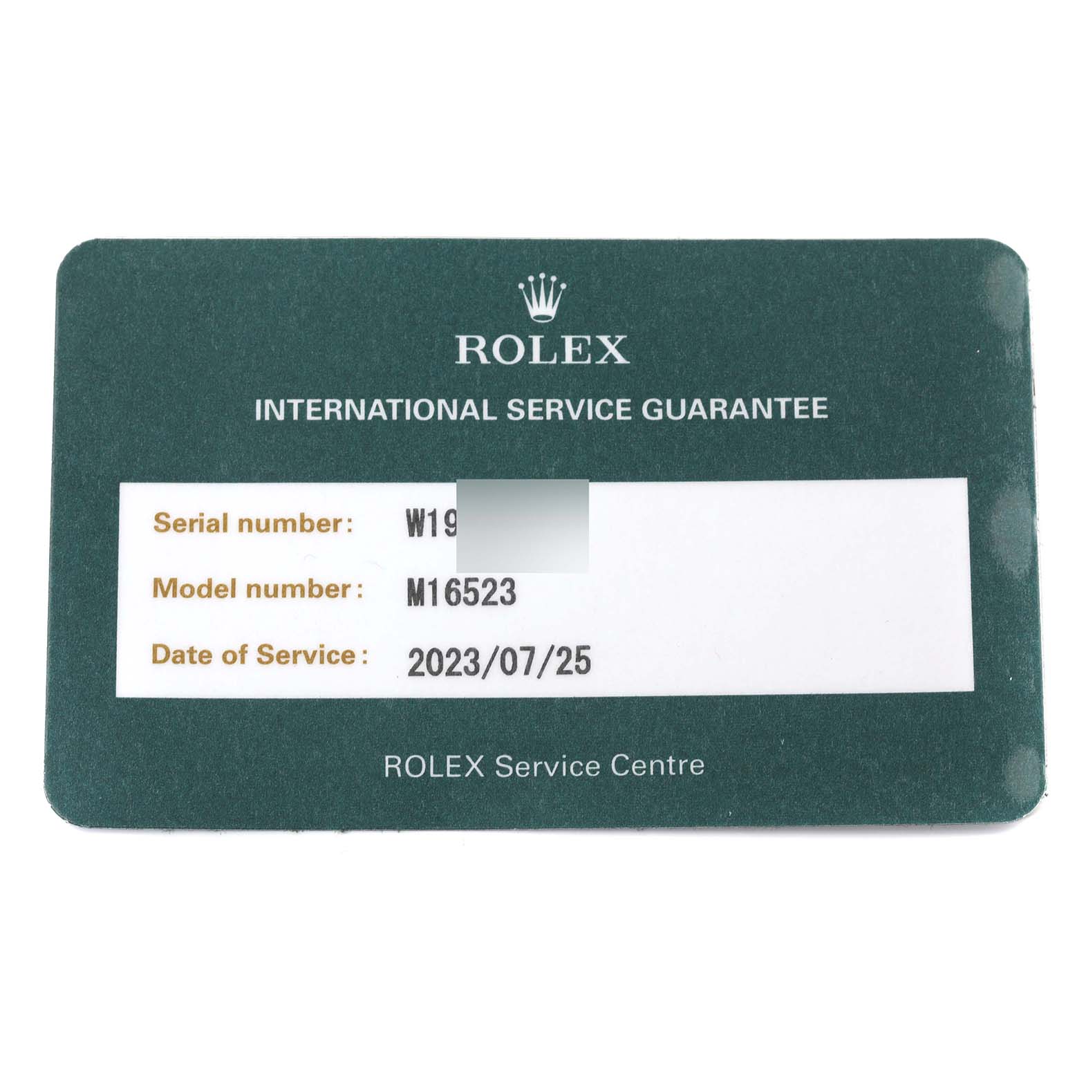 This image shows a Rolex service guarantee card for a Daytona model with the model number M16523.