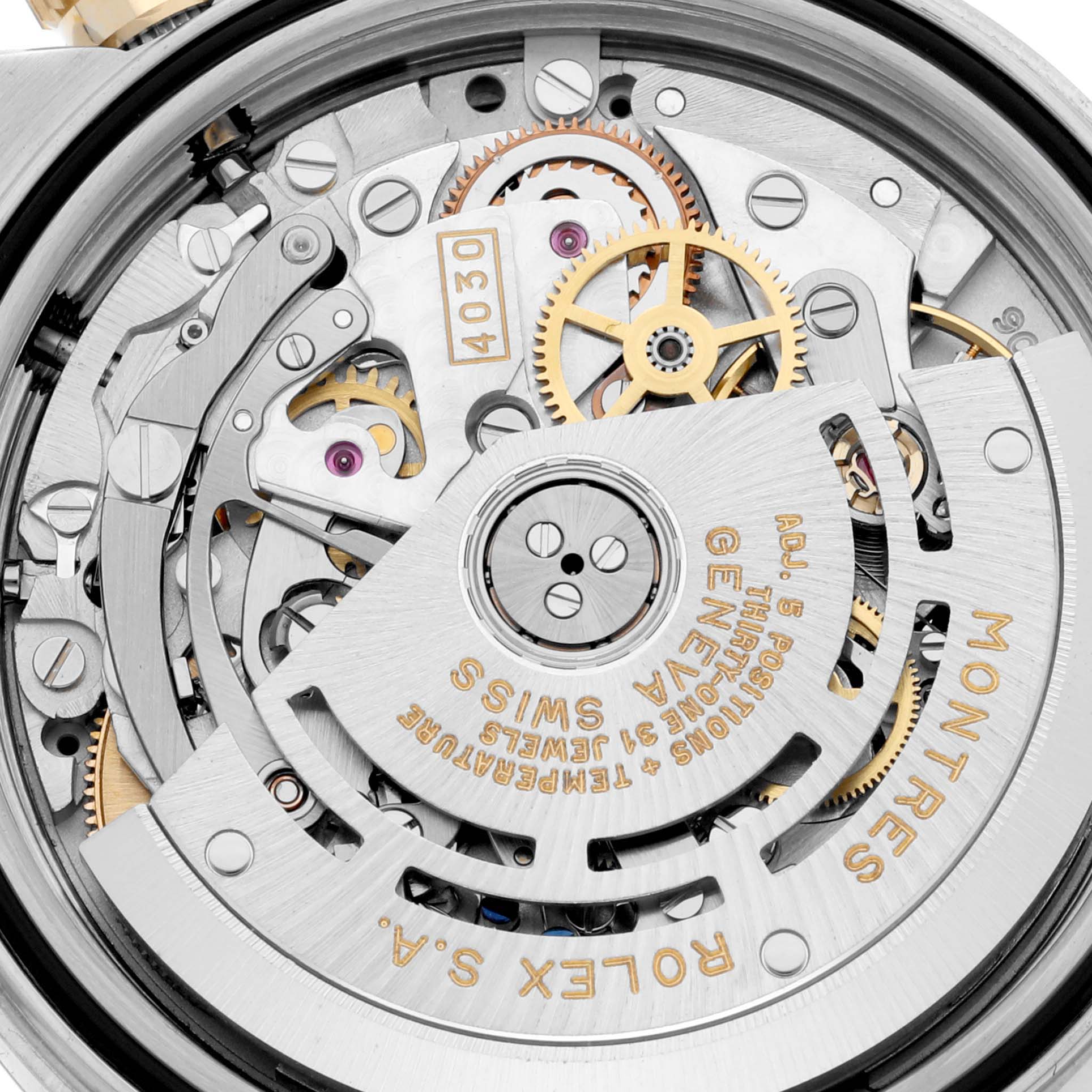 This image shows the inner mechanical movement of a Rolex Daytona 16523 Men's Steel and Gold (two tone) Champagne Dial 16523 Men's Steel and Gold (two tone) Champagne Dial watch, highlighting its intricate gears and components.