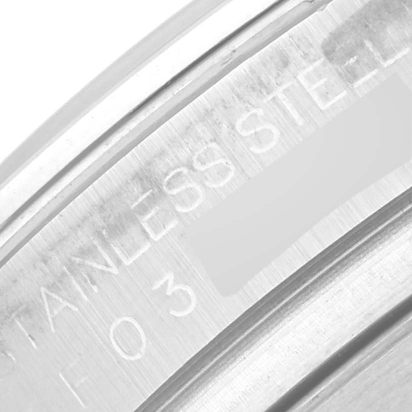 This close-up image shows the engraved stainless steel case back of a Rolex Daytona 116520 Men's Stainless Steel White Dial 116520 Men's Stainless Steel White Dial watch.