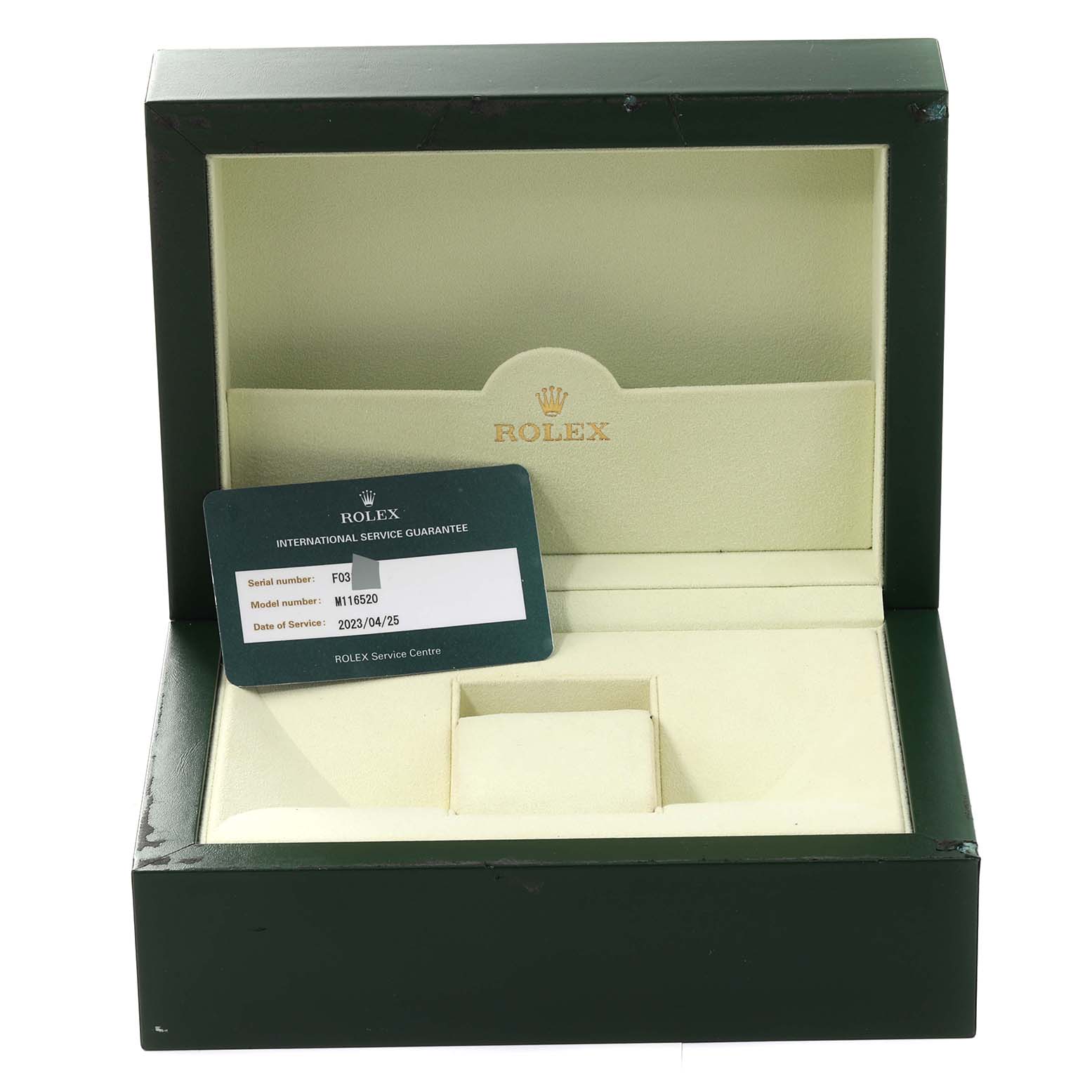 This image shows an open Rolex Daytona 116520 Men's Stainless Steel White Dial 116520 Men's Stainless Steel White Dial watch box and a service guarantee card angled inside.
