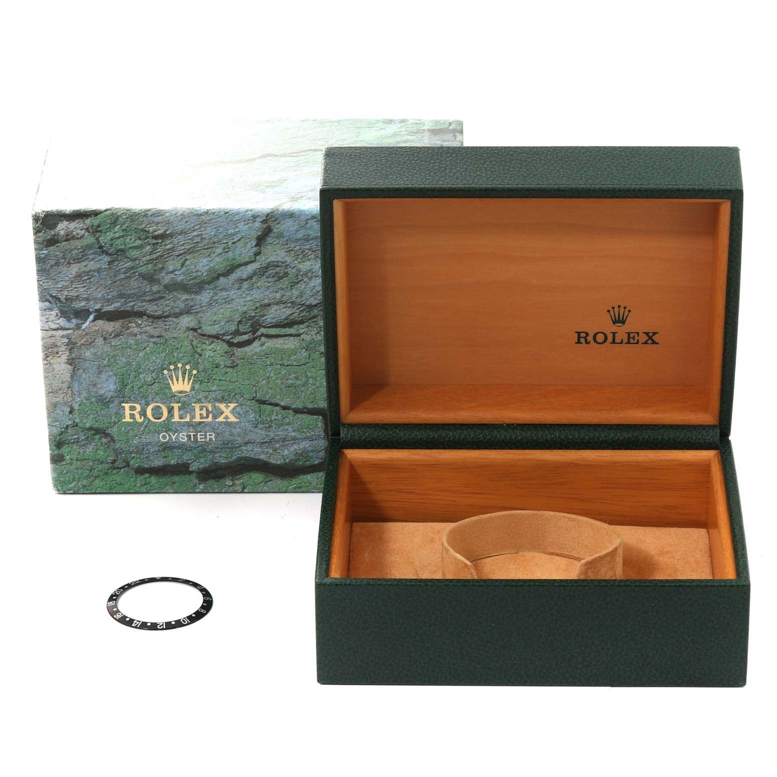 This image shows an open Rolex GMT-Master 16710 Men's Stainless Steel Black Dial 16710 Men's Stainless Steel Black Dial watch box with a green exterior and wooden interior, alongside a watch bezel.