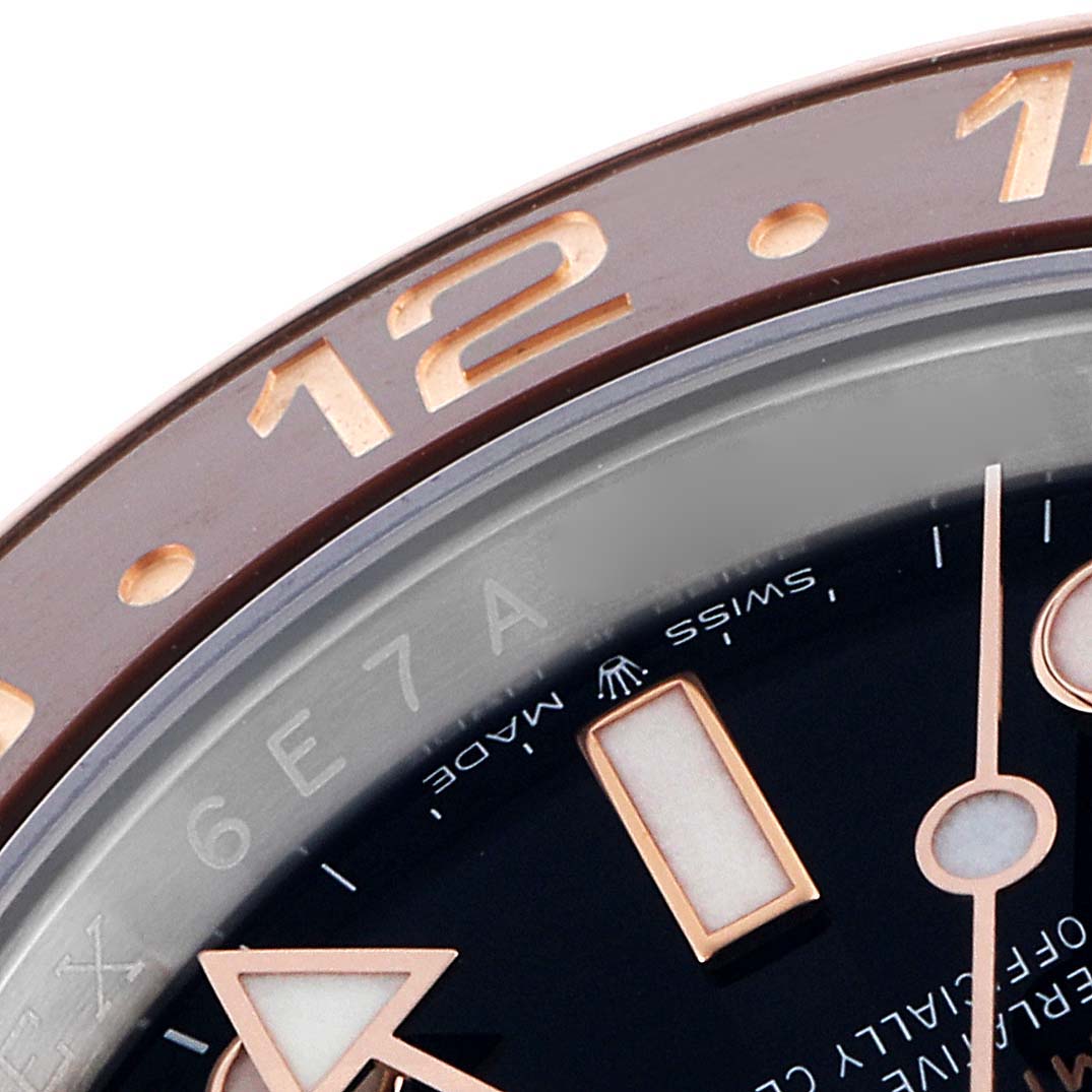 The image shows a close-up of the bezel and part of the dial of a Rolex GMT-Master 126711CHNR Men
s Steel and Gold (two tone) Black Dial 126711CHNR Men
s Steel and Gold (two tone) Black Dial, highlighting the numerals and markers.