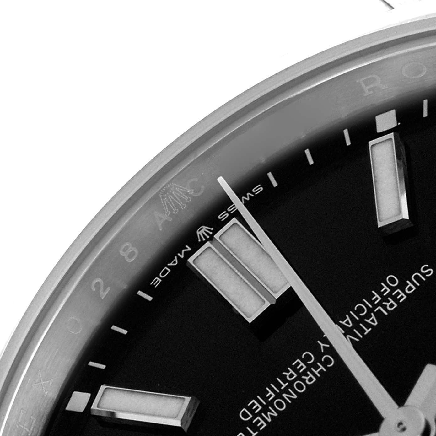The image shows a close-up angle of the Rolex Oyster Perpetual 124300 Men's Stainless Steel Black Dial 124300 Men's Stainless Steel Black Dial watch dial, focusing on the indices and part of the text.