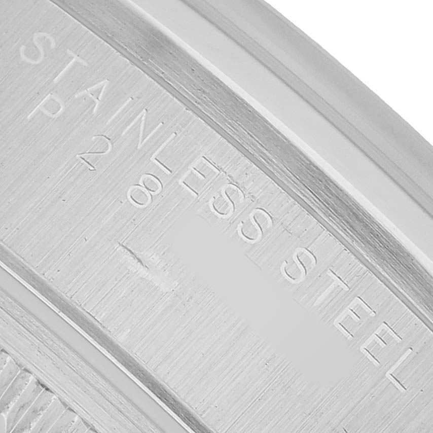 The image shows a close-up of the back of a Rolex Oyster Perpetual 15200 Men's Stainless Steel Black Dial, specifically the "Stainless Steel" engraving.