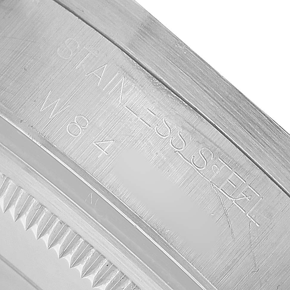 This image shows a close-up of the engraved back casing of the Rolex Oyster Perpetual 15200 Men's Stainless Steel Silver Dial, highlighting the stainless steel material.
