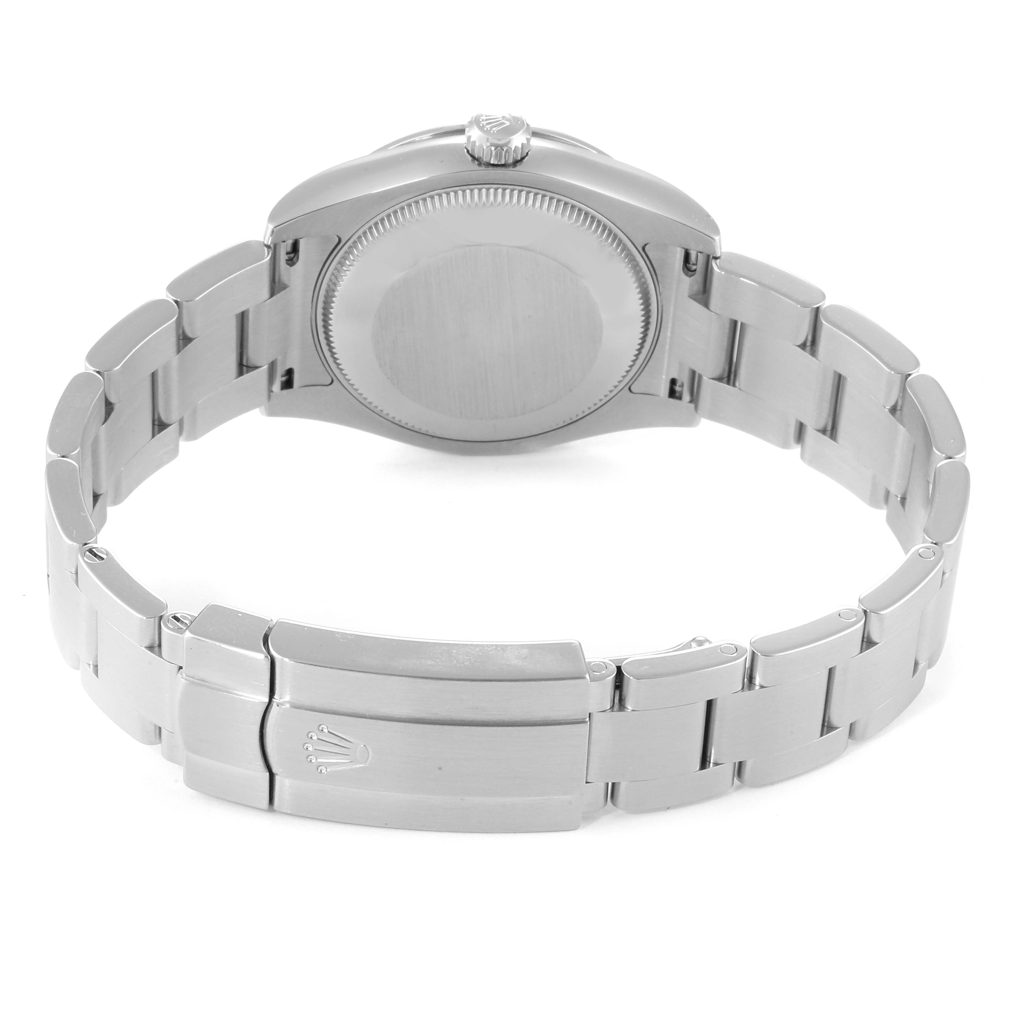This image shows the back and bracelet of a Mid-Size Rolex watch from a rear angle.