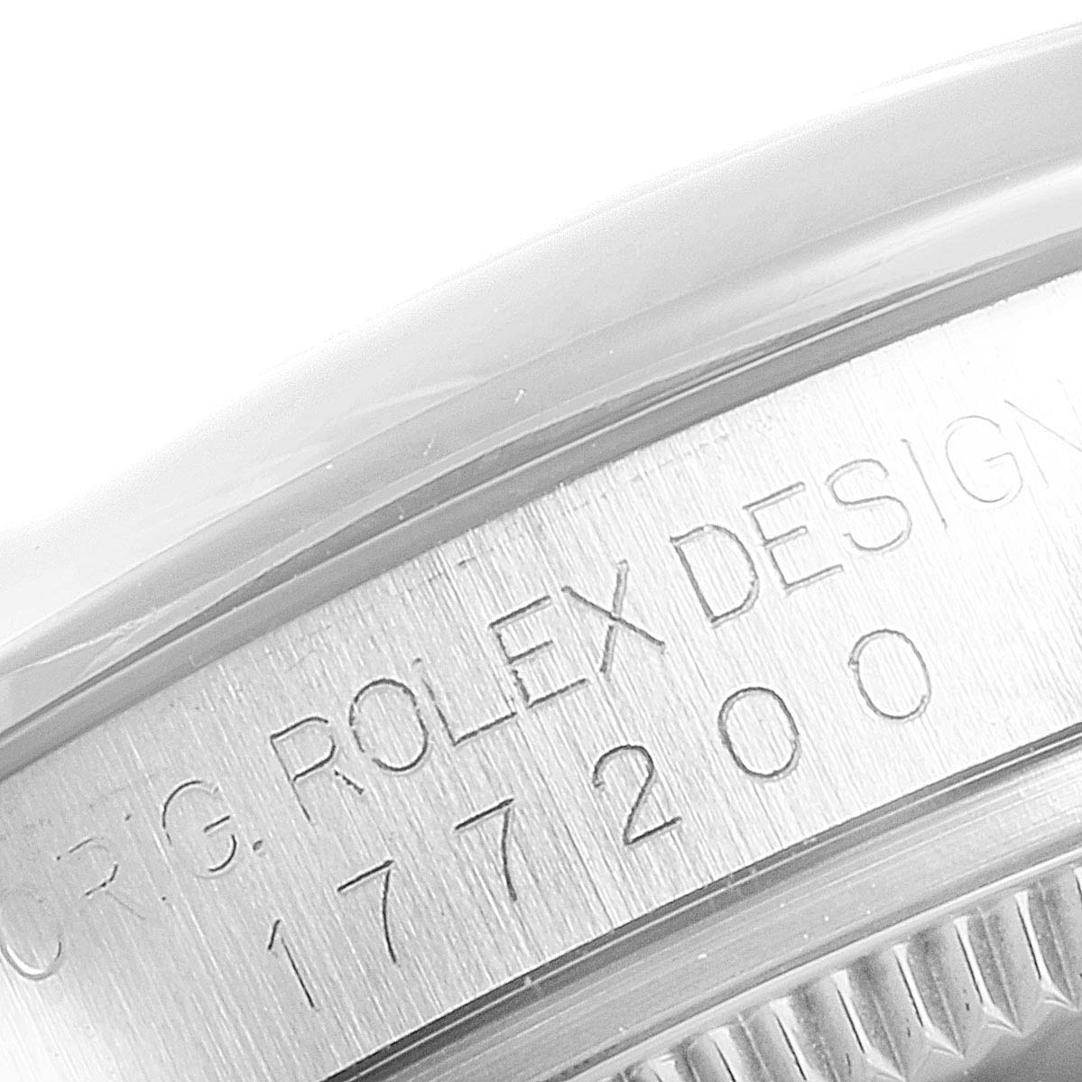 This image shows a close-up view of the engraving on the case back of a Mid-Size Rolex watch.
