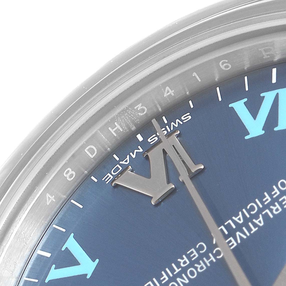This image shows a close-up of the dial and bezel of a Mid-Size Rolex watch with visible hour markers and the 
Swiss Made
 text.