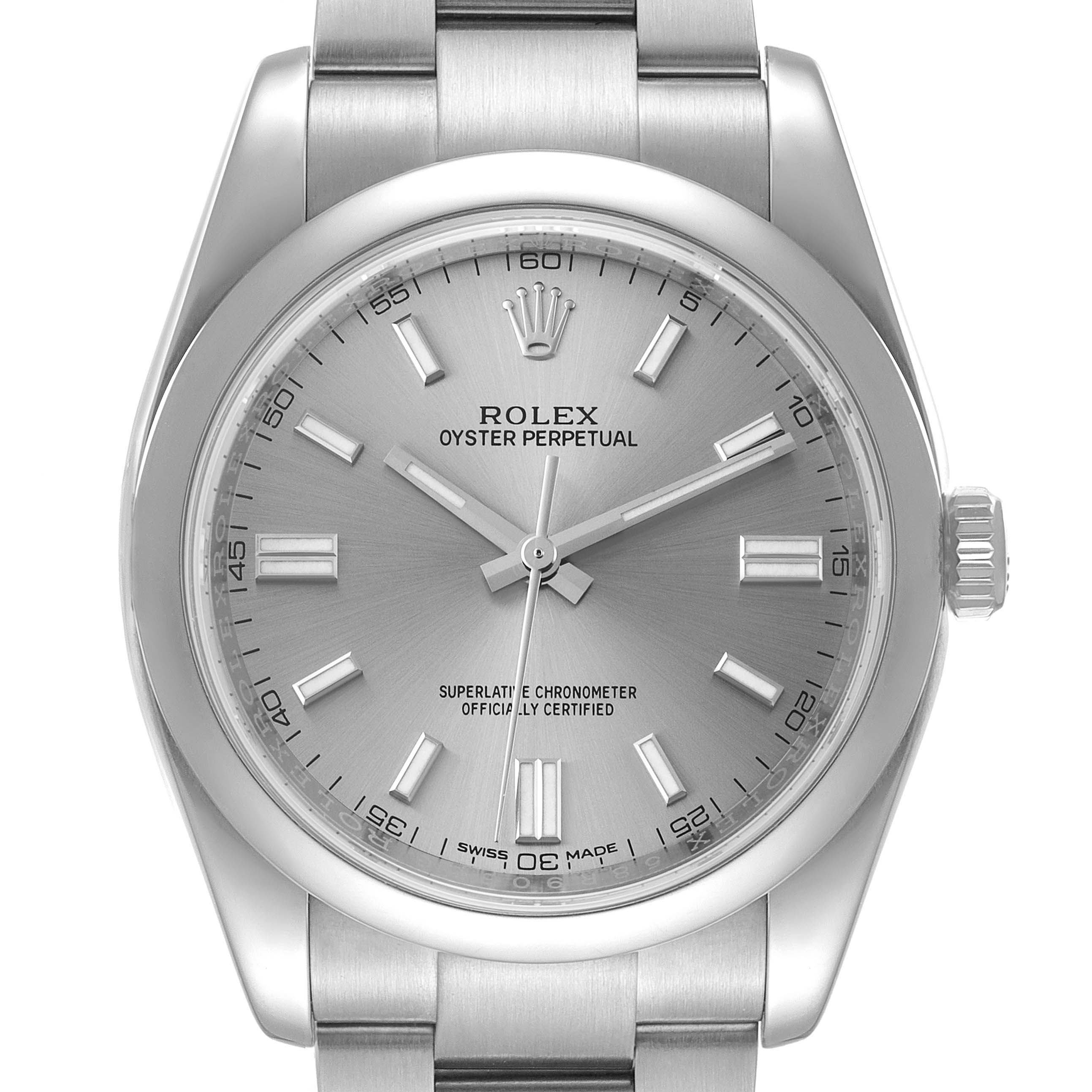 The image shows a front view of a Rolex Oyster Perpetual 116000 Men's Stainless Steel Grey Dial 116000 Men's Stainless Steel Grey Dial watch, displaying its dial, hands, hour markers, crown, and part of the bracelet.