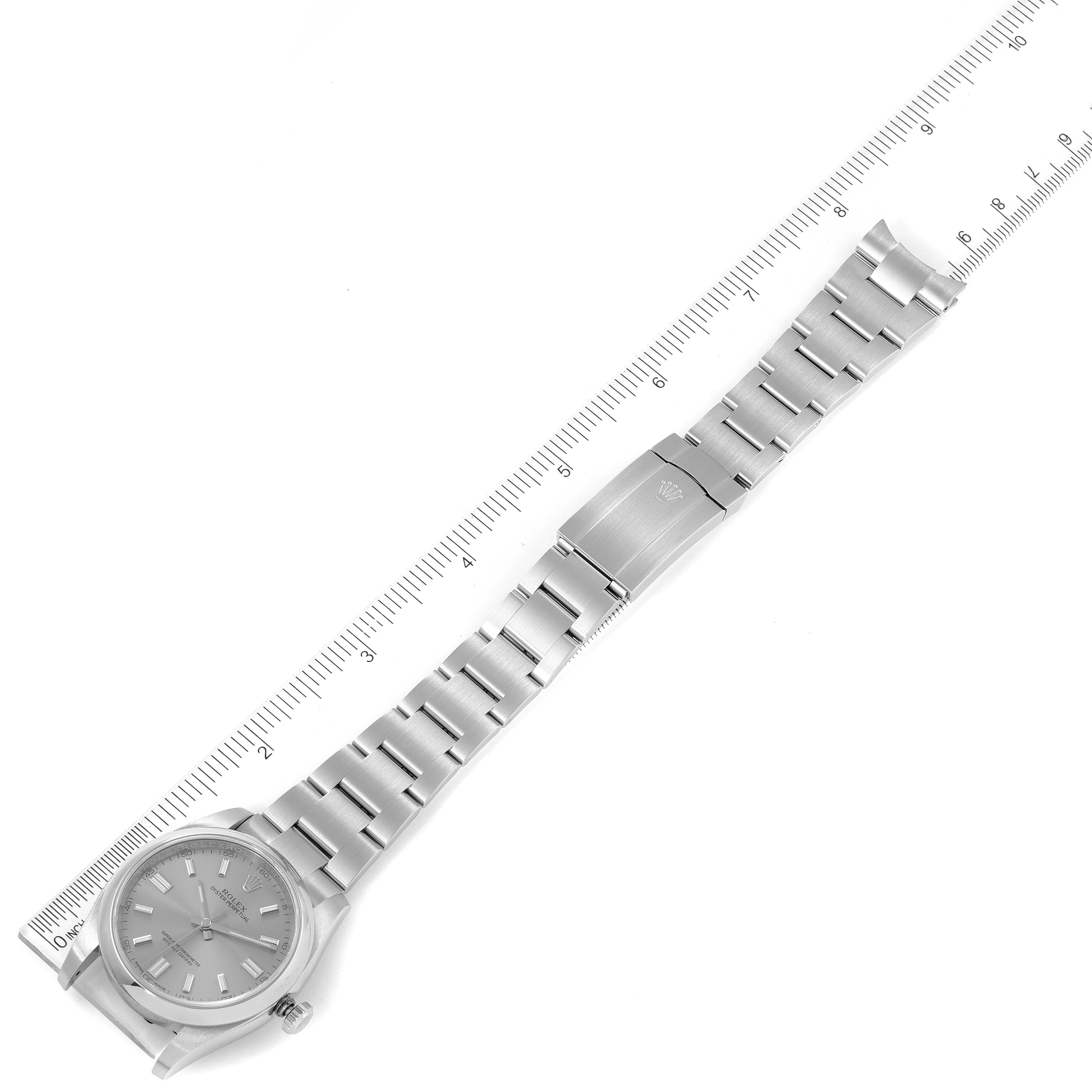 The image shows a top view of a Rolex Oyster Perpetual 116000 Men's Stainless Steel Grey Dial 116000 Men's Stainless Steel Grey Dial watch, including its dial, bracelet, and clasp.