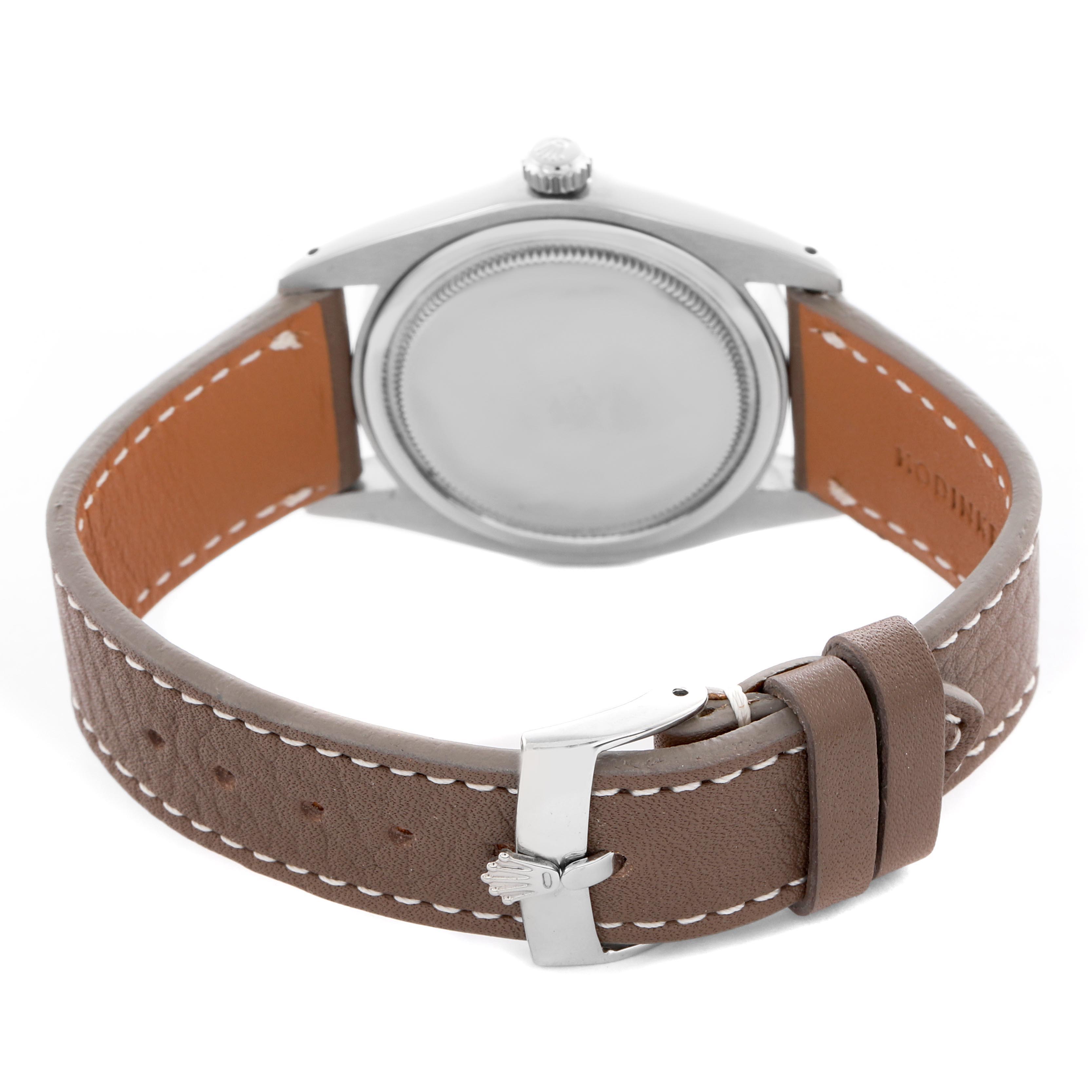 The image shows the Rolex Vintage Collection 6694 Men's Stainless Steel Black Dial 6694 Men's Stainless Steel Black Dial watch from the back, highlighting the case back, crown, and leather strap with a buckle.