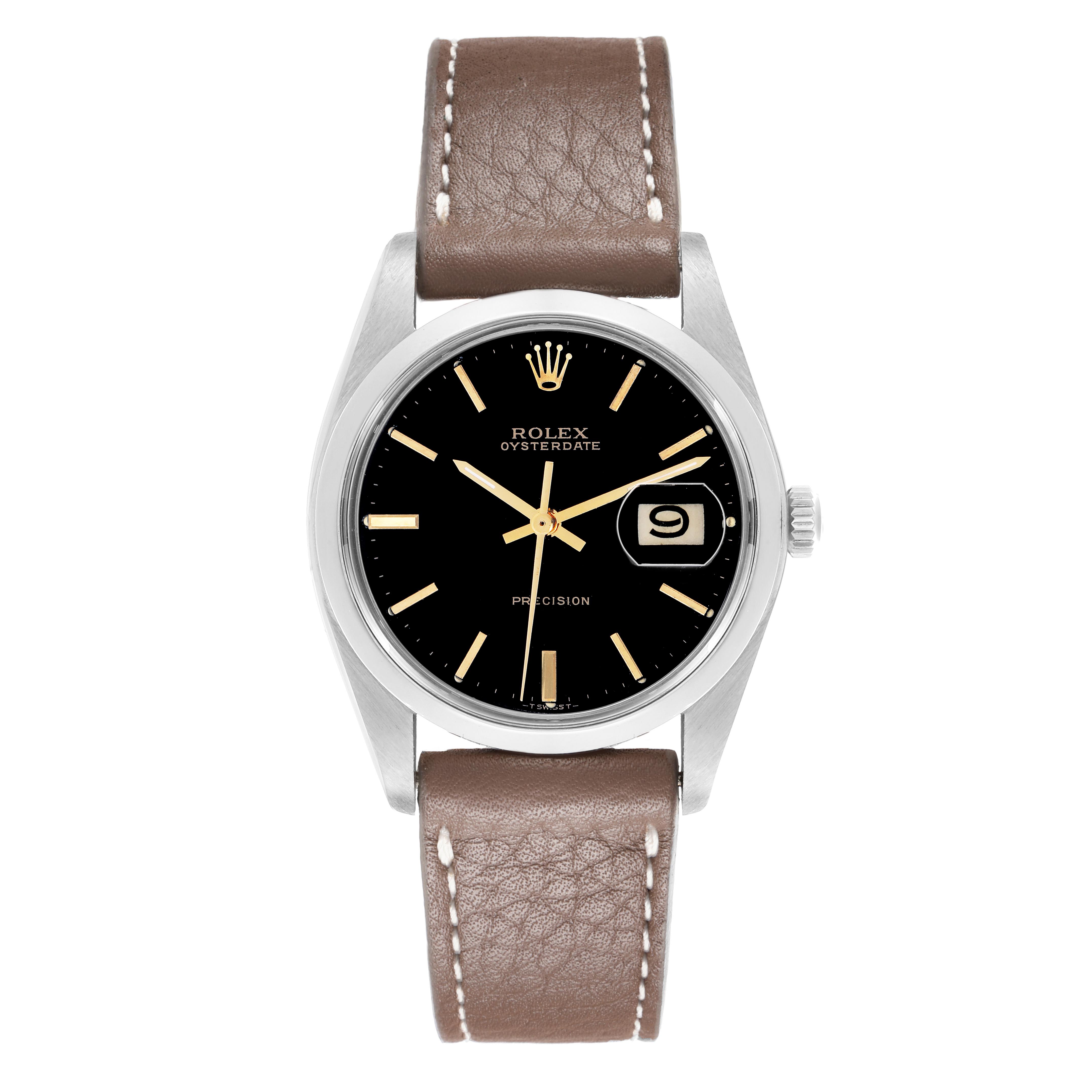 The Rolex Vintage Collection 6694 Men's Stainless Steel Black Dial 6694 Men's Stainless Steel Black Dial watch is shown from a top-down angle, displaying its black dial, date window, and brown leather strap.