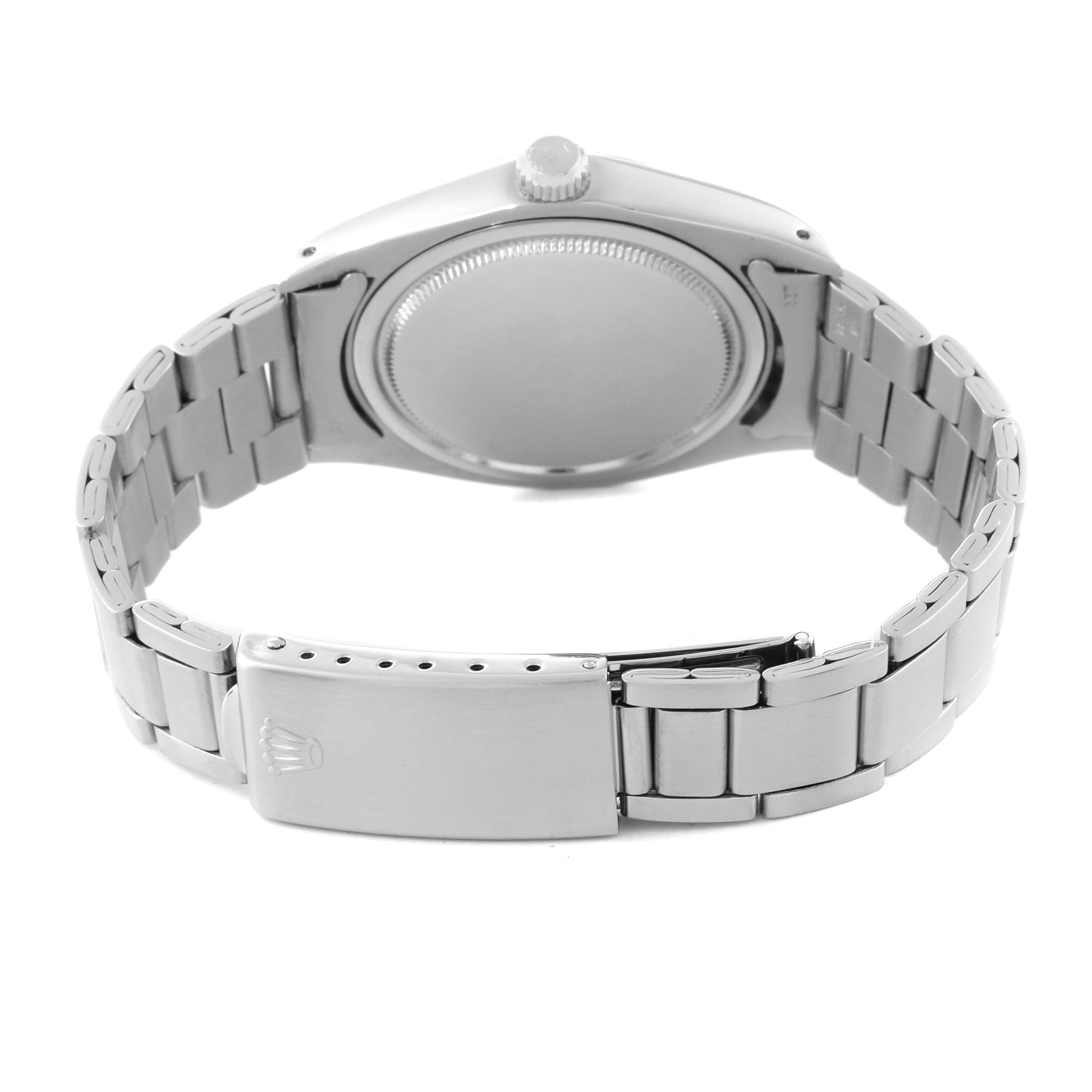 The image shows the back view of a Rolex Vintage Collection 6694 Men's Stainless Steel Silver Dial 6694 Men's Stainless Steel Silver Dial model, highlighting the case back, crown, and clasp of the metal bracelet.