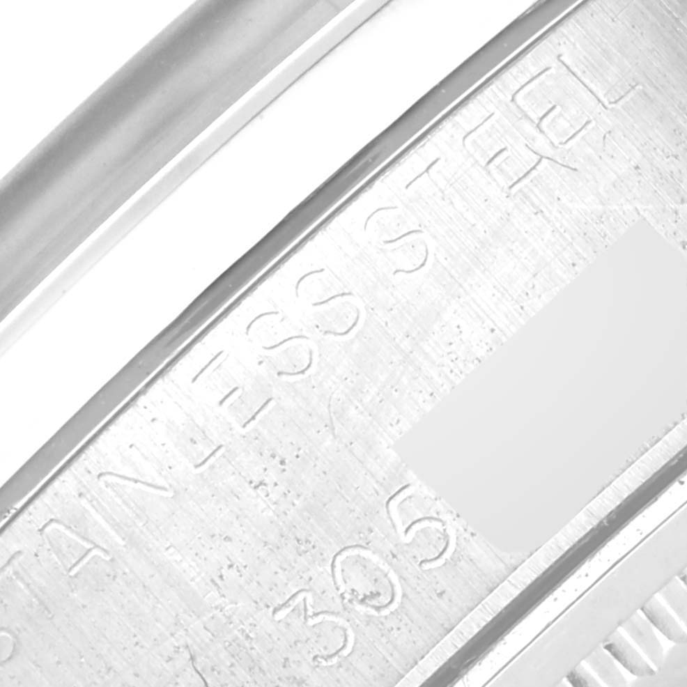 This close-up image shows the engraving on the side of a Rolex Vintage Collection 6694 Men's Stainless Steel Silver Dial 6694 Men's Stainless Steel Silver Dial watch.