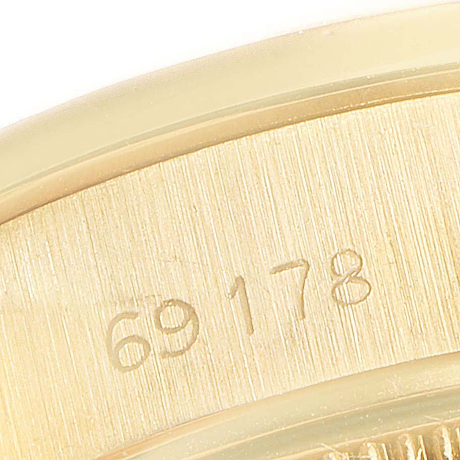 This close-up image shows the case details with the model number of the Rolex President 69178 Women
s Yellow Gold Champagne Dial 69178 Women
s Yellow Gold Champagne Dial watch.