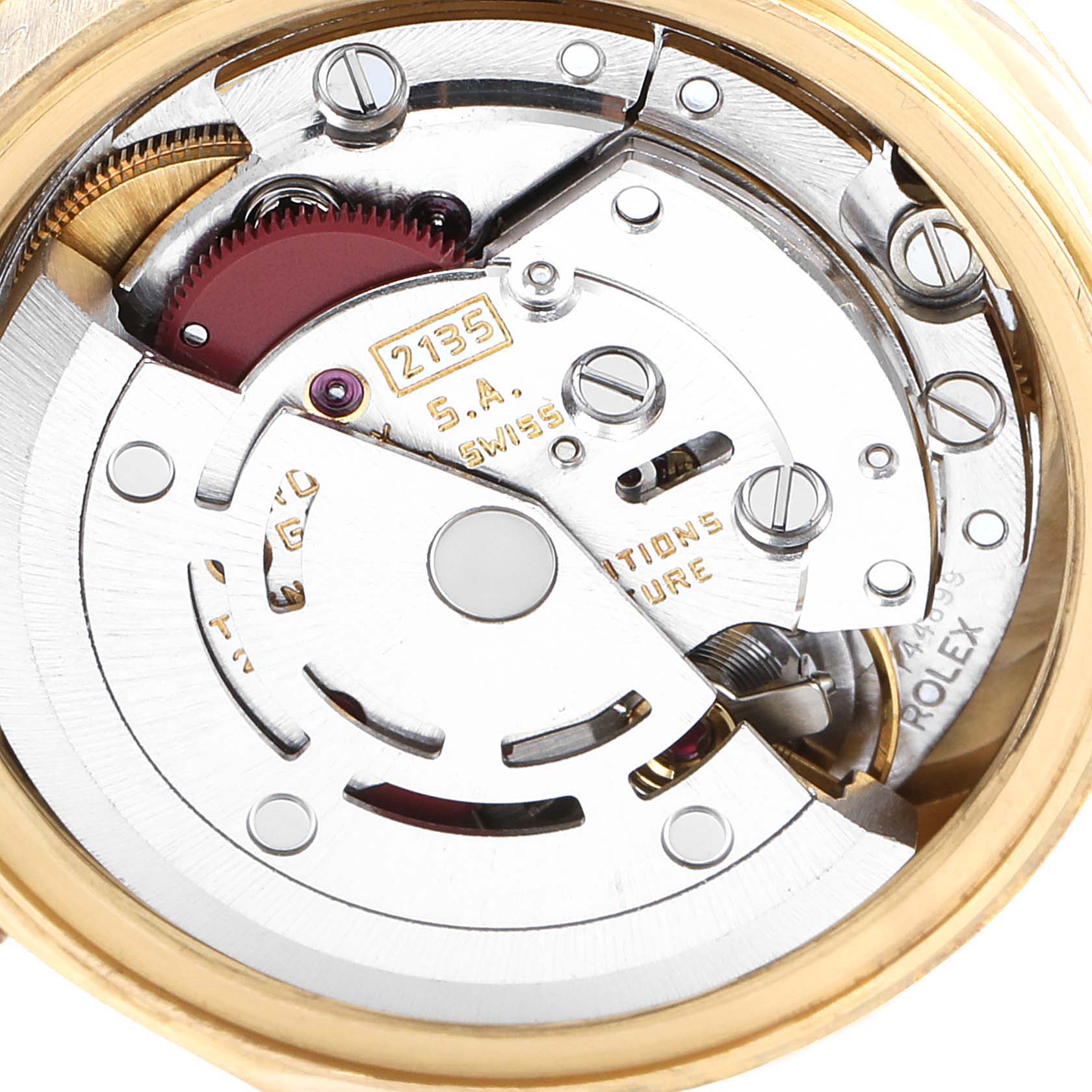 The image shows the movement of the Rolex President 69178 Women
s Yellow Gold Champagne Dial 69178 Women
s Yellow Gold Champagne Dial model watch, highlighting the intricate internal mechanics.