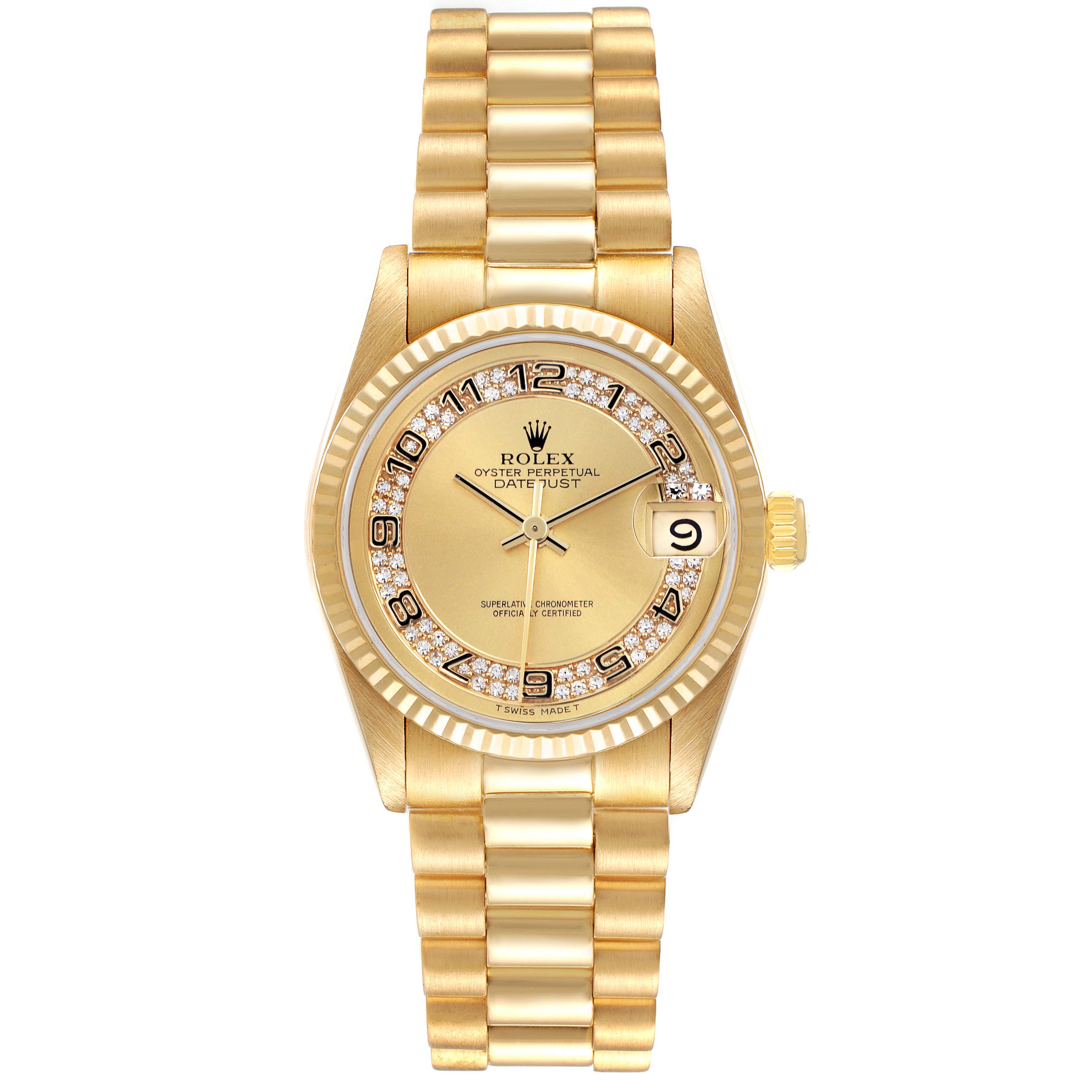 The Rolex Mid-Size watch is shown from a top-down angle, featuring a gold bracelet, fluted bezel, and date window.