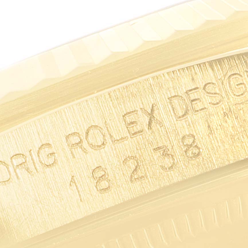 This image shows a close-up of the engraved model number on the side of the Rolex President 18238 Men's Yellow Gold Black Dial 18238 Men's Yellow Gold Black Dial watch case.