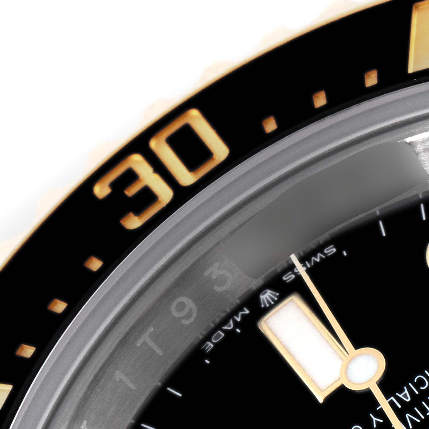 This image shows a close-up of the Rolex Sea-Dweller 126603 Men's Steel and Gold (two tone) Black Dial 126603 Men's Steel and Gold (two tone) Black Dial's bezel and part of the dial, including the "30" marker and part of a watch hand.