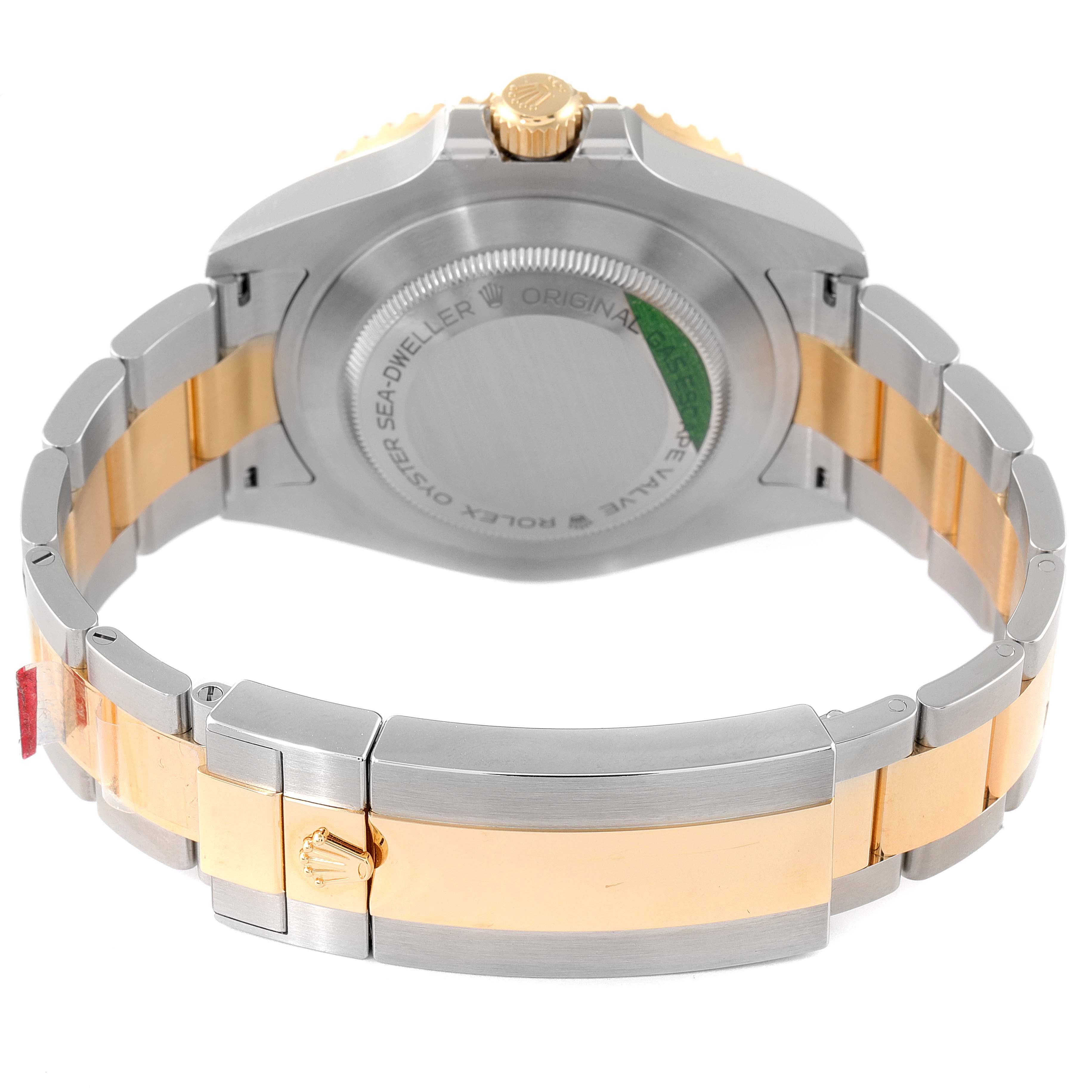 This image shows the back case and bracelet of a Rolex Sea-Dweller 126603 Men's Steel and Gold (two tone) Black Dial 126603 Men's Steel and Gold (two tone) Black Dial watch, with a focus on the two-tone metal.