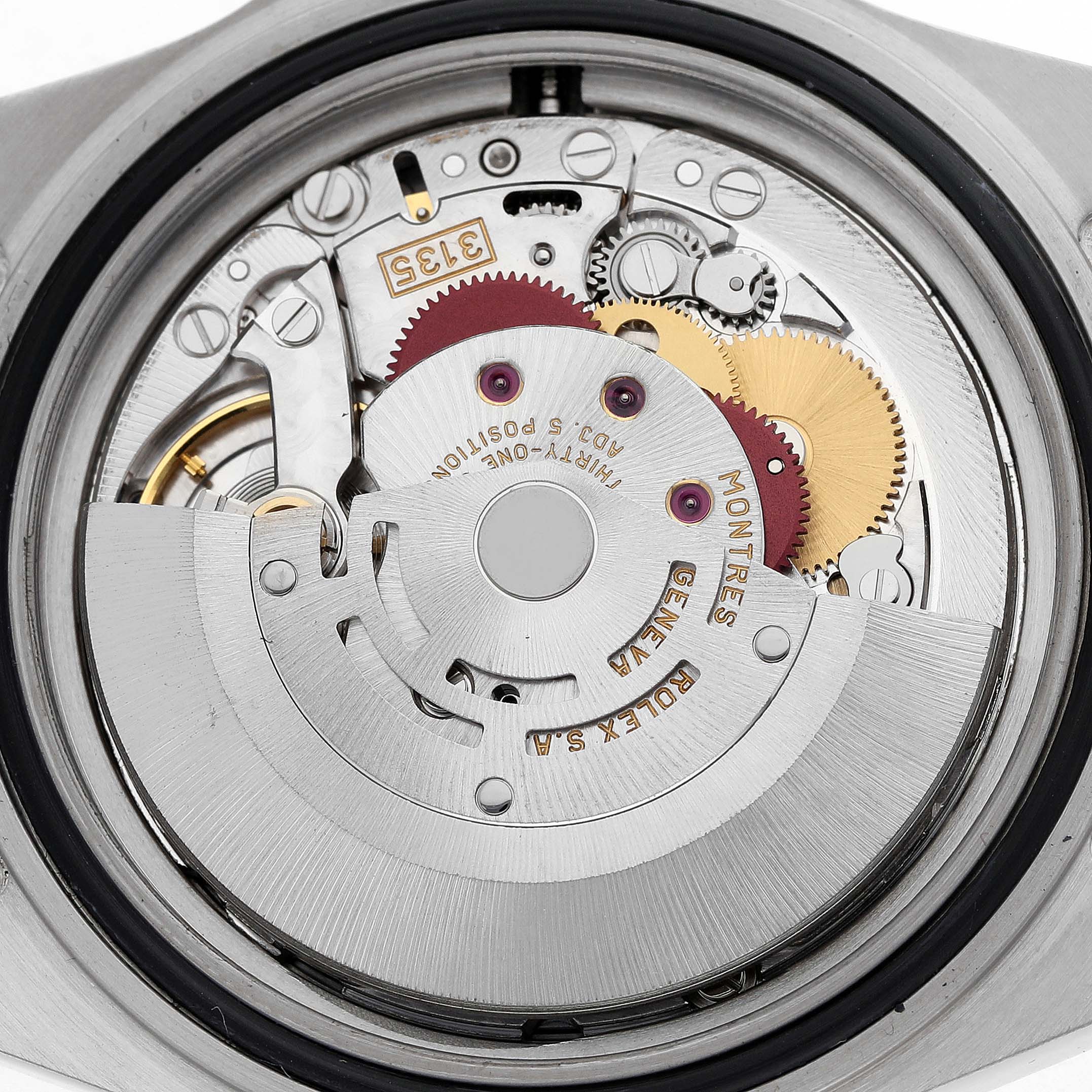 The image shows the back view of a Rolex Submariner 16610 Men's Stainless Steel Black Dial watch, focusing on its intricate movement and gears.