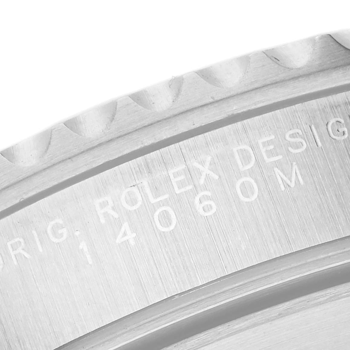 This image shows a close-up of the side engraving and bezel teeth of a Rolex Submariner 14060 Men
s Stainless Steel Black Dial 14060 Men
s Stainless Steel Black Dial watch.