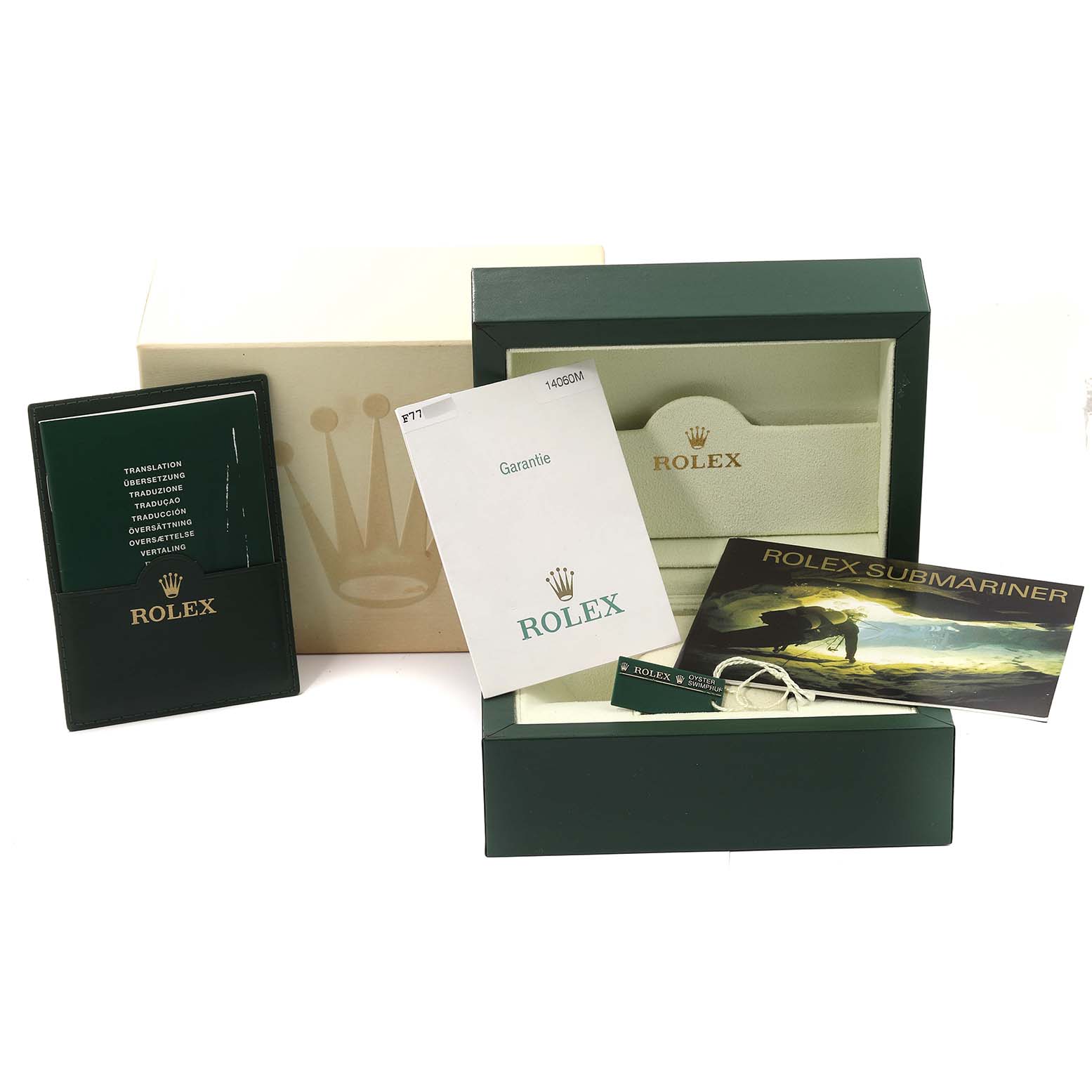 The image shows a Rolex Submariner 14060 Men
s Stainless Steel Black Dial 14060 Men
s Stainless Steel Black Dial presentation set, including the box, warranty card, booklet, and instruction manual.