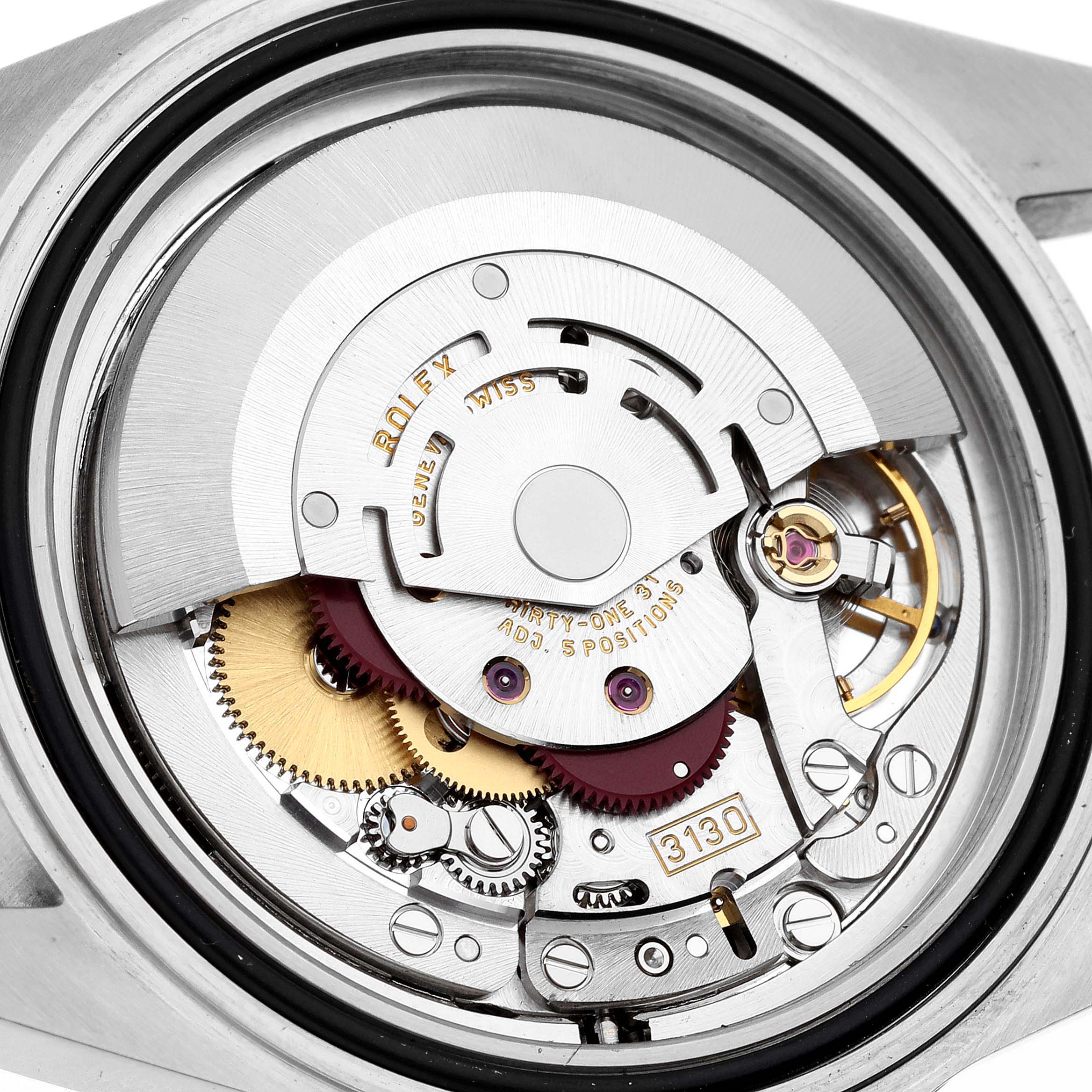 This image shows the internal mechanism of a Rolex Submariner 14060 Men
s Stainless Steel Black Dial 14060 Men
s Stainless Steel Black Dial watch, including gears and the rotor.