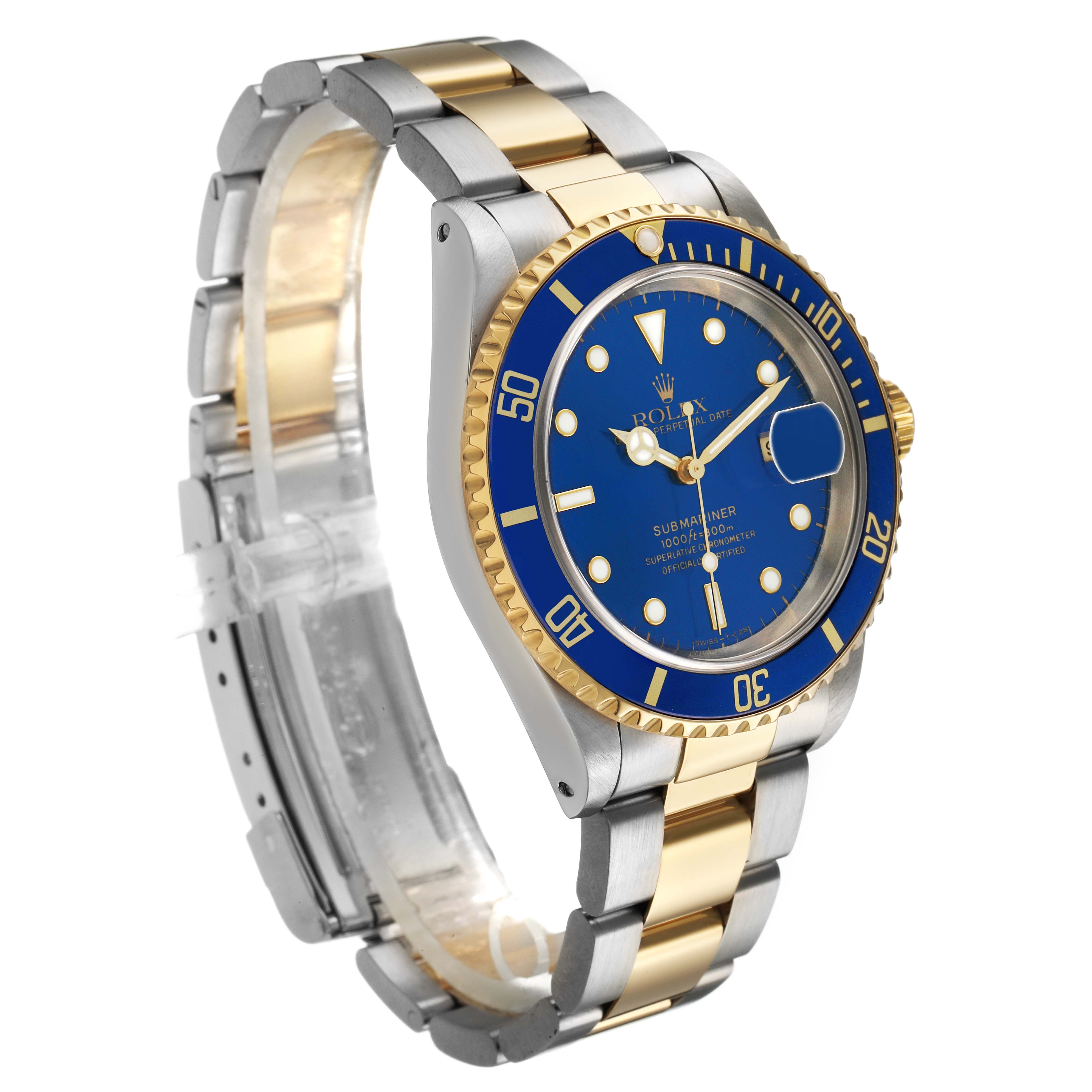 The Rolex Submariner 16613 Men's Steel and Gold (two tone) Blue Dial watch is shown at an oblique angle, highlighting its blue dial, bezel, and two-tone bracelet.
