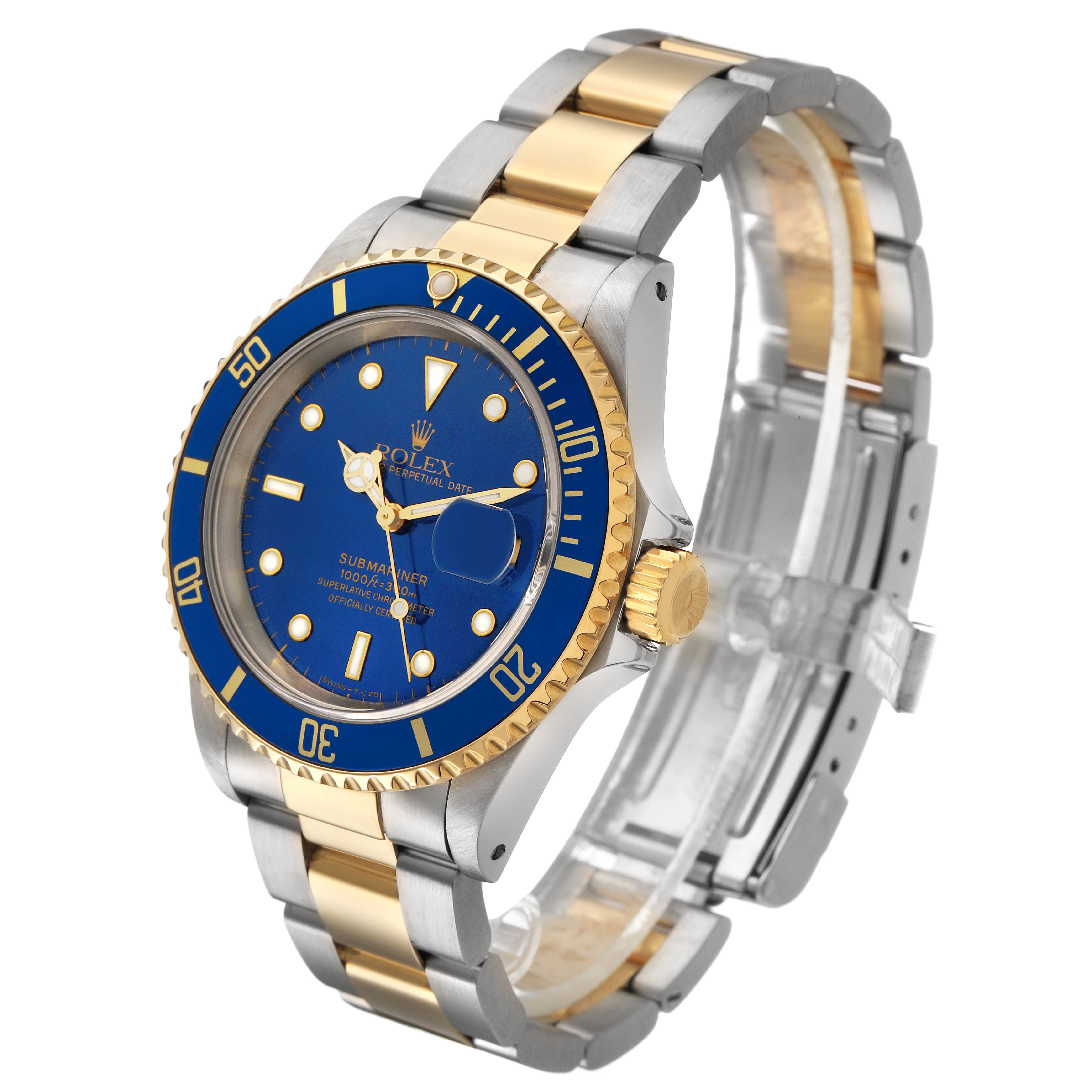 The Rolex Submariner 16613 Men's Steel and Gold (two tone) Blue Dial watch is displayed at a three-quarter angle, showing the blue dial, bezel, two-tone bracelet, and crown.