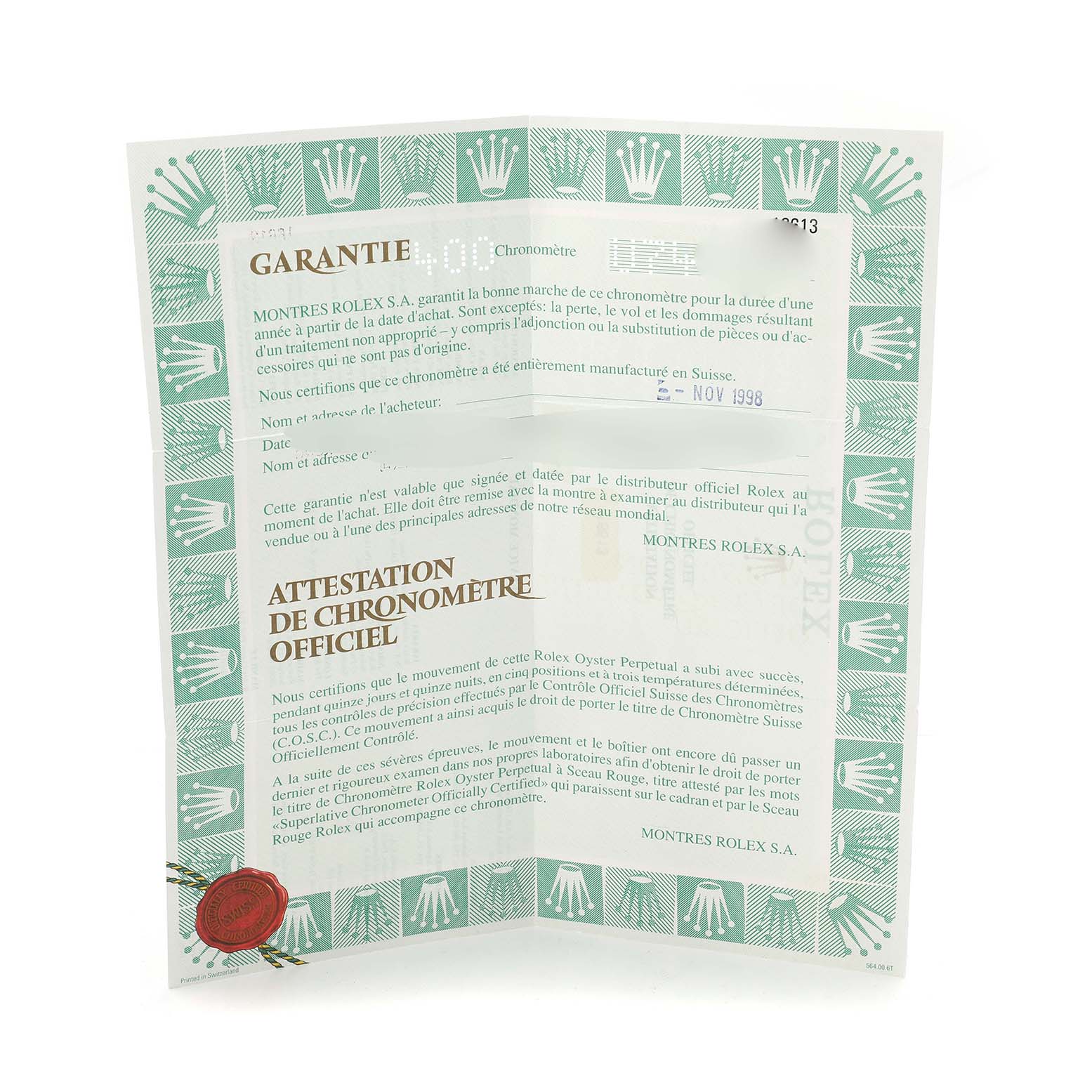 The image shows warranty and certification paperwork for a Rolex Submariner 16613 Men's Steel and Gold (two tone) Blue Dial, featuring branded text and logos.