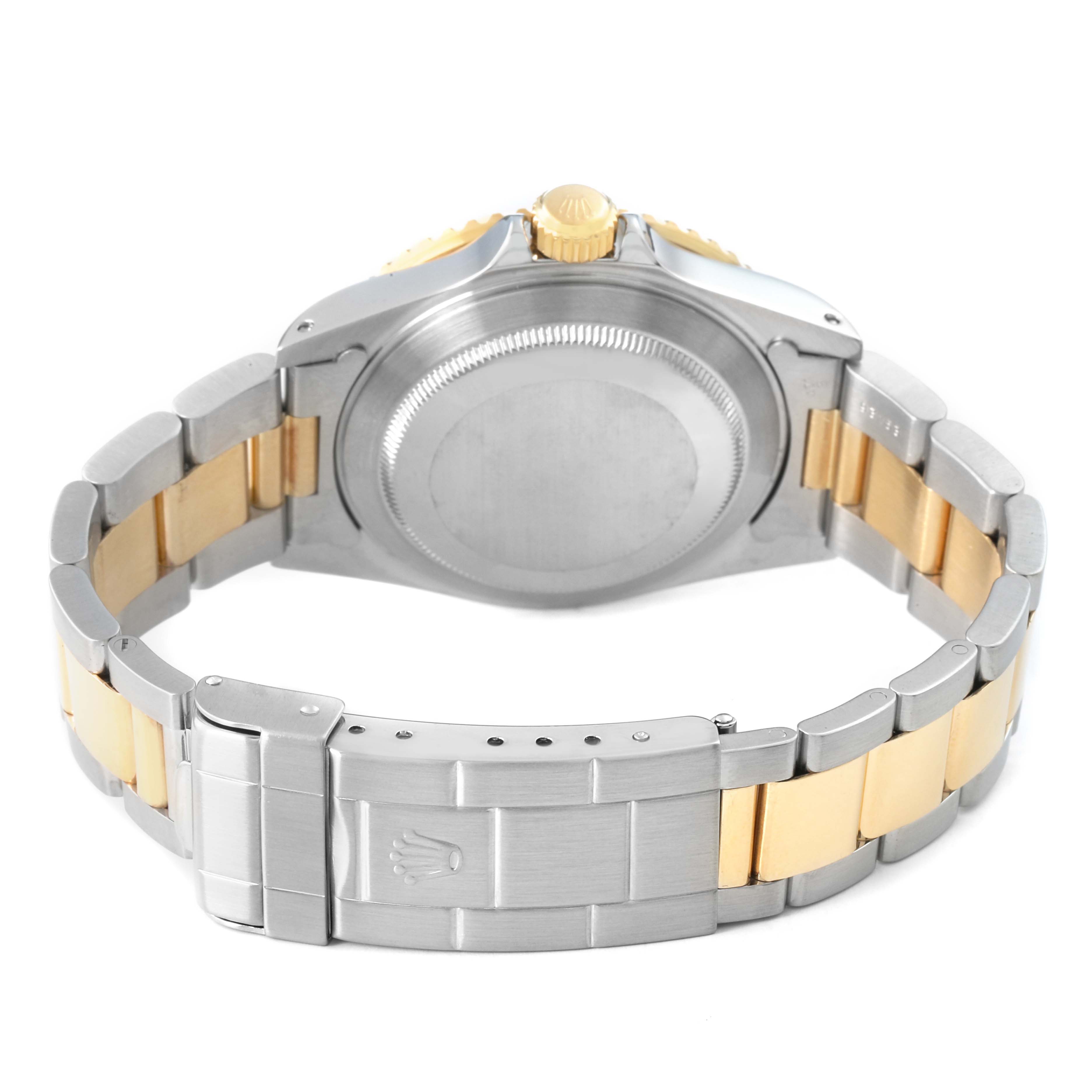 The Rolex Submariner 16613 Men's Steel and Gold (two tone) Blue Dial is shown from the rear, highlighting its clasp, case back, and two-tone bracelet.